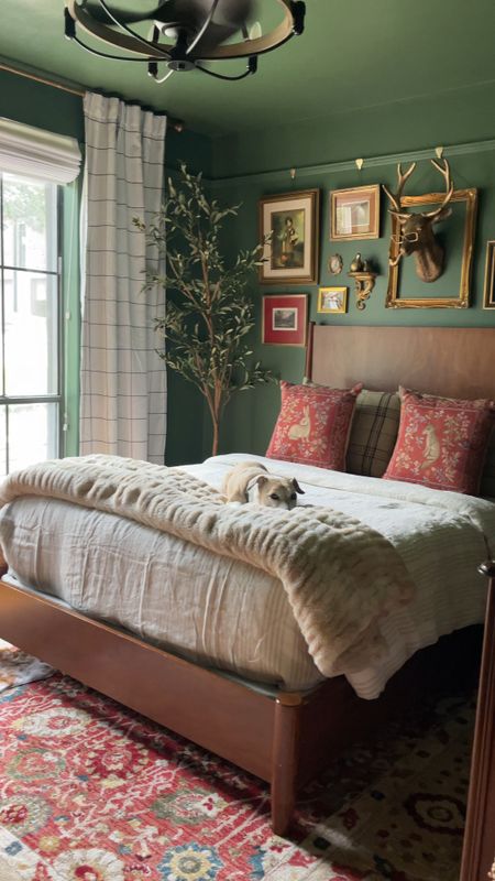 Vintage bedroom design
Vintage rug | olive tree | stripe curtains | striped duvet | deer rug | vintage pillows | gold ornate arched mirror

#LTKHome
