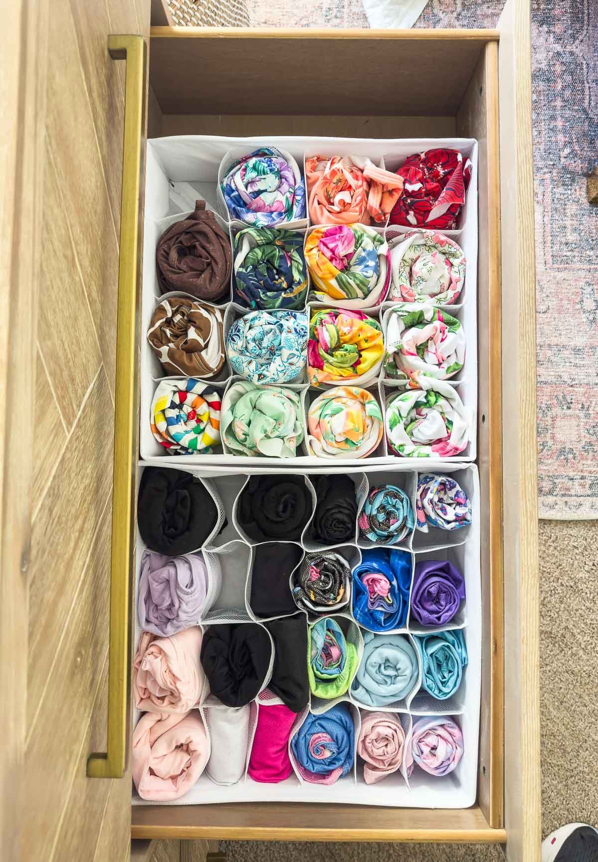 It only takes a few key items and methods to organize all of your dresser drawers and to keep them organized. These cell organizer boxes are perfect for holding socks, under garments and more. I also use drawer dividers to separate larger items that I fold and roll to a precise fit in the dresser drawers. wide dresser bedroom organization home organization dresser drawer organization home storage 

#LTKKids #LTKHome #LTKFindsUnder50