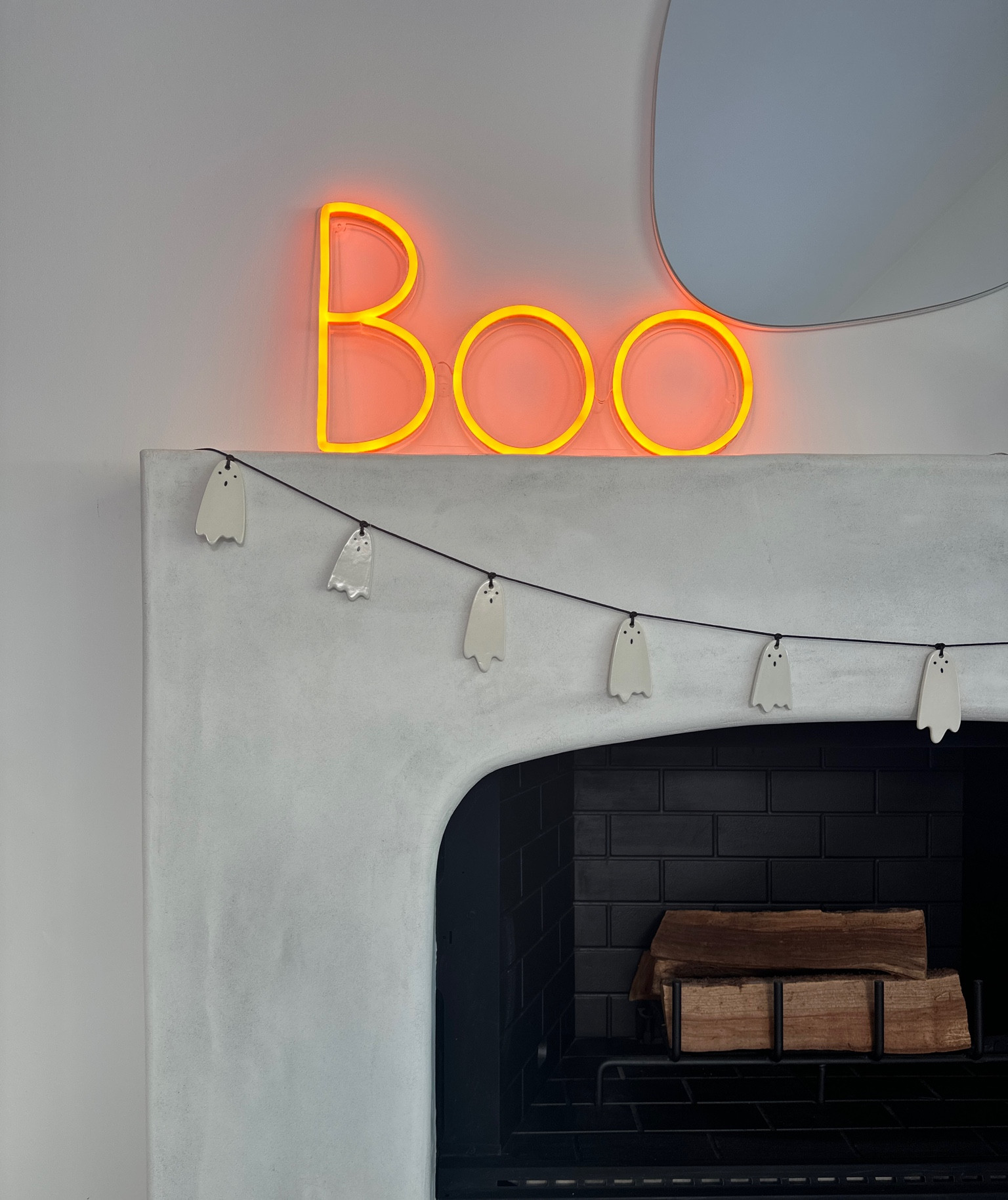Simple and modern Halloween mantle decor. My orange ‘Boo’ sign was a custom order. See link below. It was so easy and the finished light arrived so fast!  

Neon light | Boo | Halloween | mantle decor | spooky season | festive 

#LTKSeasonal #LTKhome #LTKHalloween