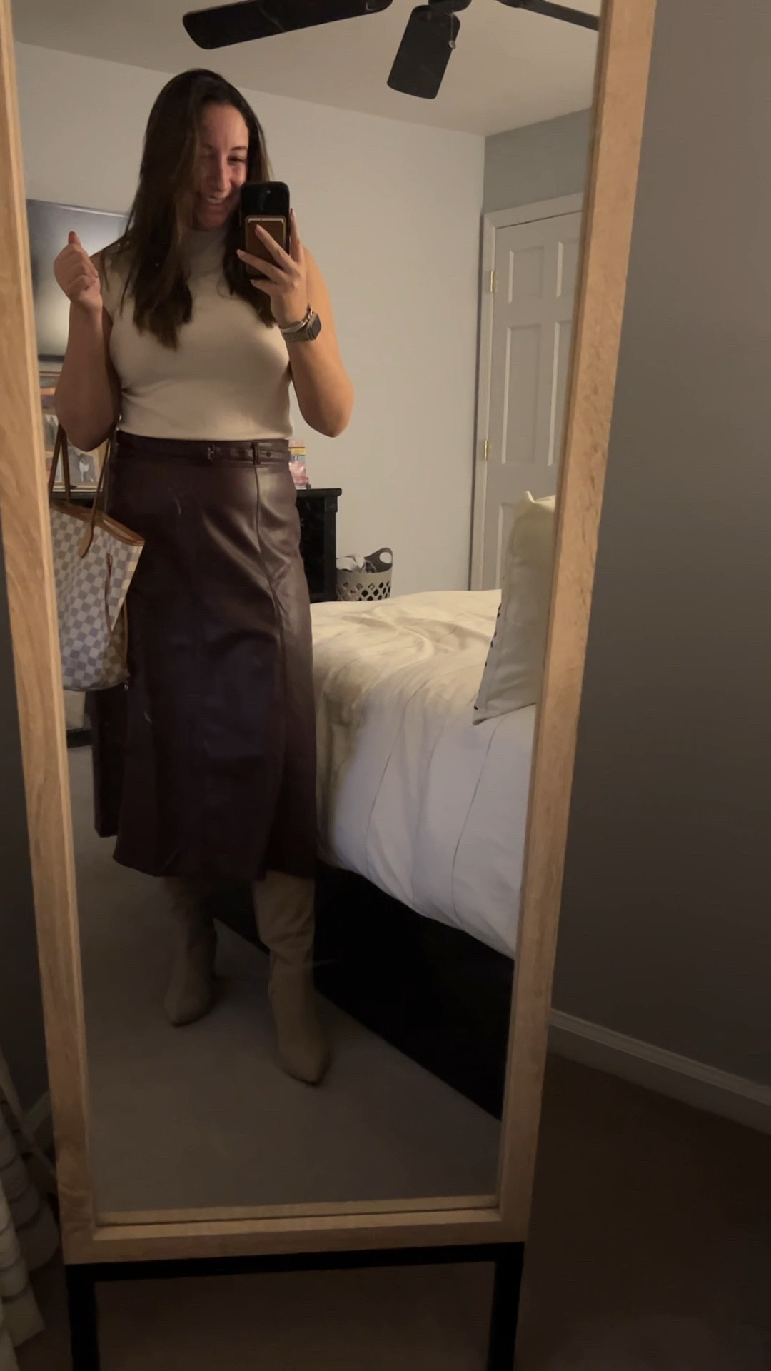 Workwear outfit ideas for any woman. Maroon leather skirt with cream knit top with cream boots.

#LTKunder100 #LTKworkwear #LTKSeasonal