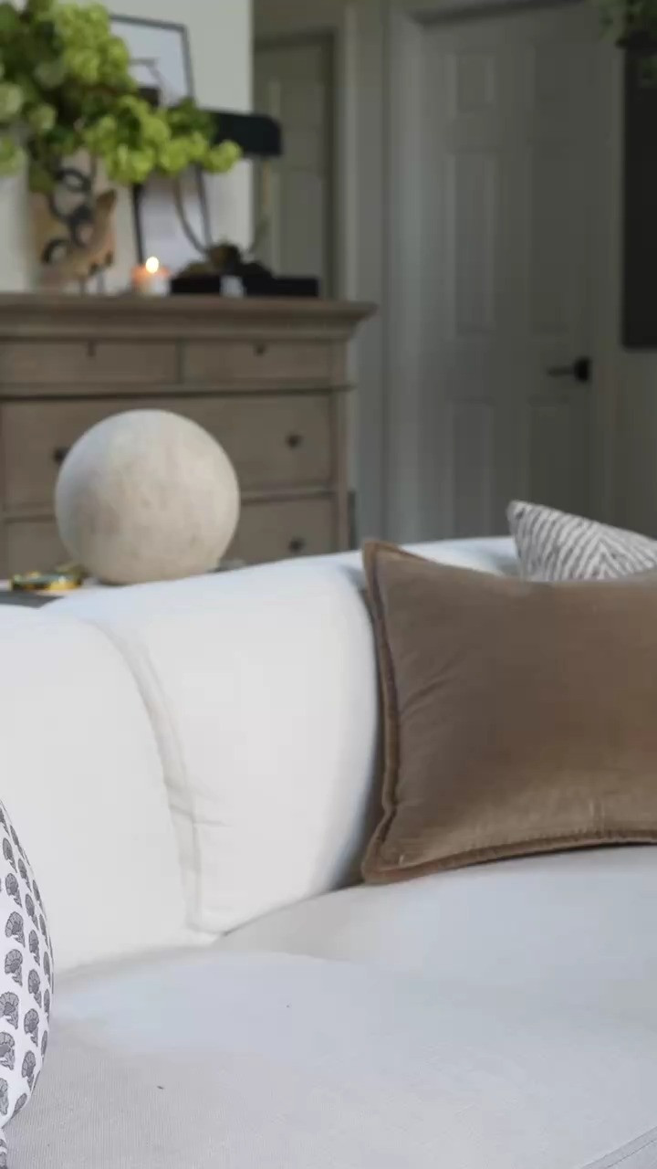 WOW I am completely obsessed with this cozy interior styling moment. The neutral coffee table books, the delicate blue floral ginger jar, and that softly glowing candle feel like the perfect mix of timeless decor and elevated living room styling. I love layering classic pieces and natural textures to create warm, welcoming spaces that feel both sophisticated and effortlessly cozy!!!  

 #LTKSpringSale #LTKSeasonal #LTKHome