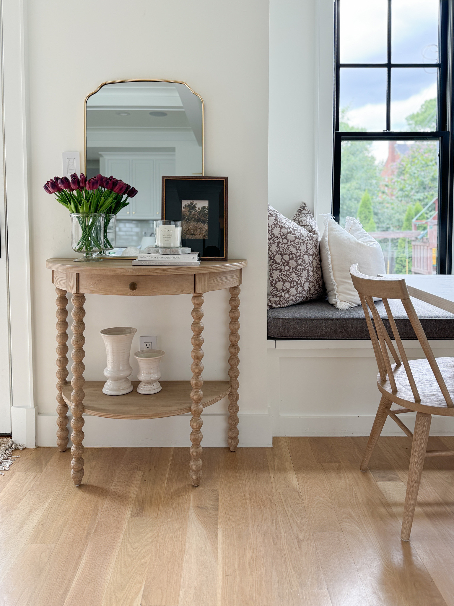 My beautiful Demilune carved light oak console table is on sale now during the fall sale at Serena & Lily! This is such a classic and beautiful piece. Perfect for an entryway or small area that you want to style. I love the classic design - this definitely gives a Nancy Myers vibe to our Breakfast nook! I paired it with some affordable decor like this brass arched mirror from target my favorite candle and art from the studio McGee collection at target

#LTKSaleAlert #LTKStyleTip #LTKHome