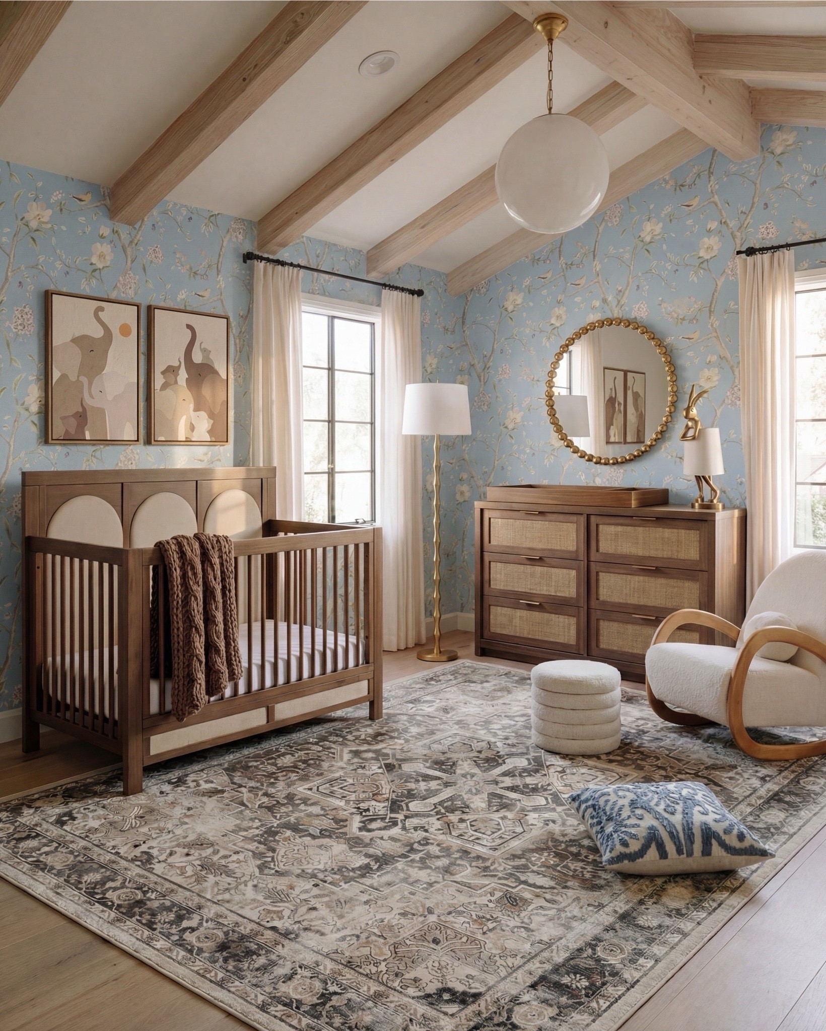 This nursery feels soft, whimsical, and thoughtfully layered—designed to grow with your little one while still feeling elevated and calm. The powder blue floral wallpaper sets a dreamy backdrop, while light wood beams and furniture keep the space warm and grounded. Natural textures, rounded shapes, and gentle curves make the room feel cozy, playful, and serene all at once.

The styling is sweet but intentional—plush wall decor, open shelving for toys and books, and a mix of classic wood pieces with soft textiles create a nursery that feels curated, not cluttered.

Shop the Look:
• Light blue floral wallpaper
• Natural wood exposed ceiling beams
• Solid wood crib (warm oak tone)
• Neutral crib mattress + fitted sheet
• Knit baby blanket (soft brown)
• Vintage-inspired area rug (muted blue + beige)
• Wood dresser with woven drawer fronts
• Round gold-framed wall mirror
• Brass table lamp with white shade
• White boucle accent chair
• Round upholstered pouf (cream)
• Wooden toy shelving unit
• Front-facing wooden book rack
• Children’s board books (colorful covers)
• Plush teddy bear
• Soft cloud wall decor
• Star-shaped wall pillows (neutral tones)
• Crescent moon wall decor
• Beaded rainbow toy
• Sheer white curtain panels
• Black curtain rod with rings
#LTKSaleAlert

#LTKsale #LTKhome