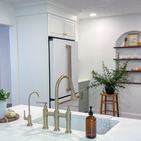 Add the perfect finishing touches to your kitchen. Beautiful under mount fireclay sink, brushed brass Kitchen Faucet, Water filtration system.  White Cafe Appliances. For the win! 

#LTKhome #LTKsalealert #LTKfamily