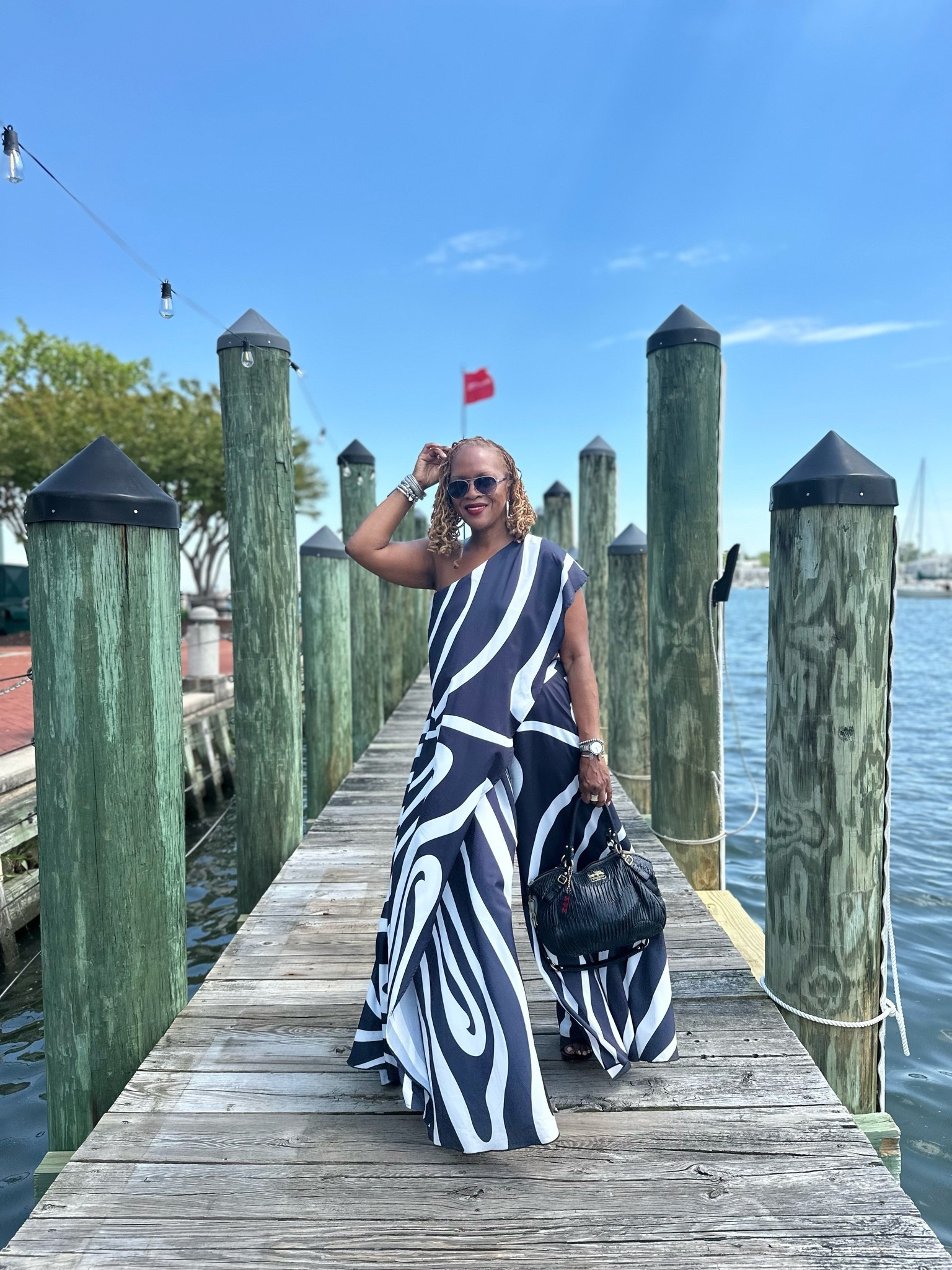 Summer two piece set 

Bold black and white swirl print one-shoulder draped top, perfect for fashion-forward events or vacation-ready styling. Featuring an asymmetric neckline with a dramatic oversized drape and elongated hem, this statement piece brings effortless drama with a sleek, modern edge. The fluid, lightweight fabric creates beautiful movement while the graphic print guarantees all eyes on you, finished with an inner mesh cami for secure wear. Pair with the matching AKIRA Label Trina Pleated Palazzo Pant for an ultra-chic, matching moment

#LTKMothersDay #LTKvlog #LTKootd