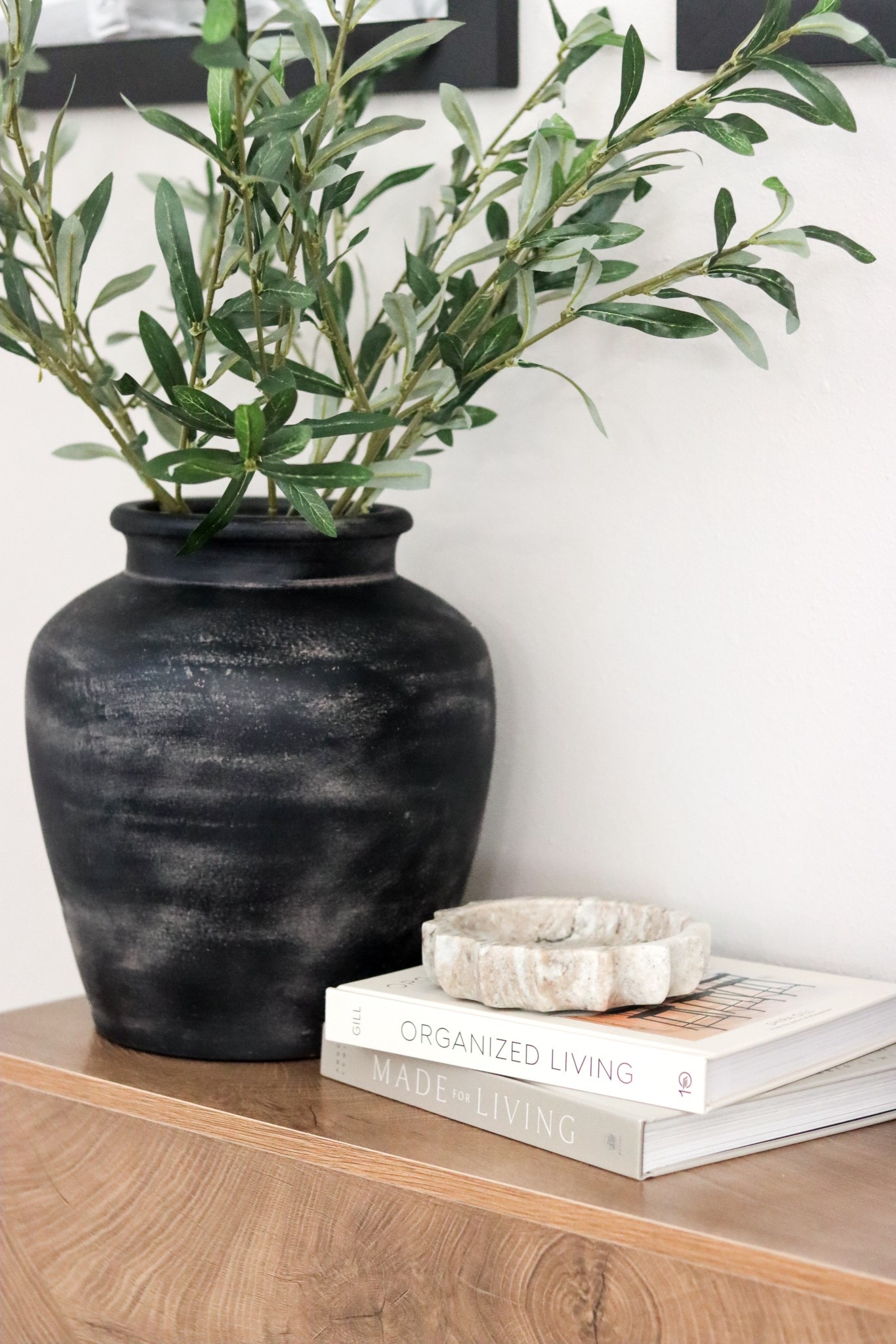 Entryway table decor 🖤 Loving these decorative books, marble tray and terra cotta vase with artificial stems

#LTKHome