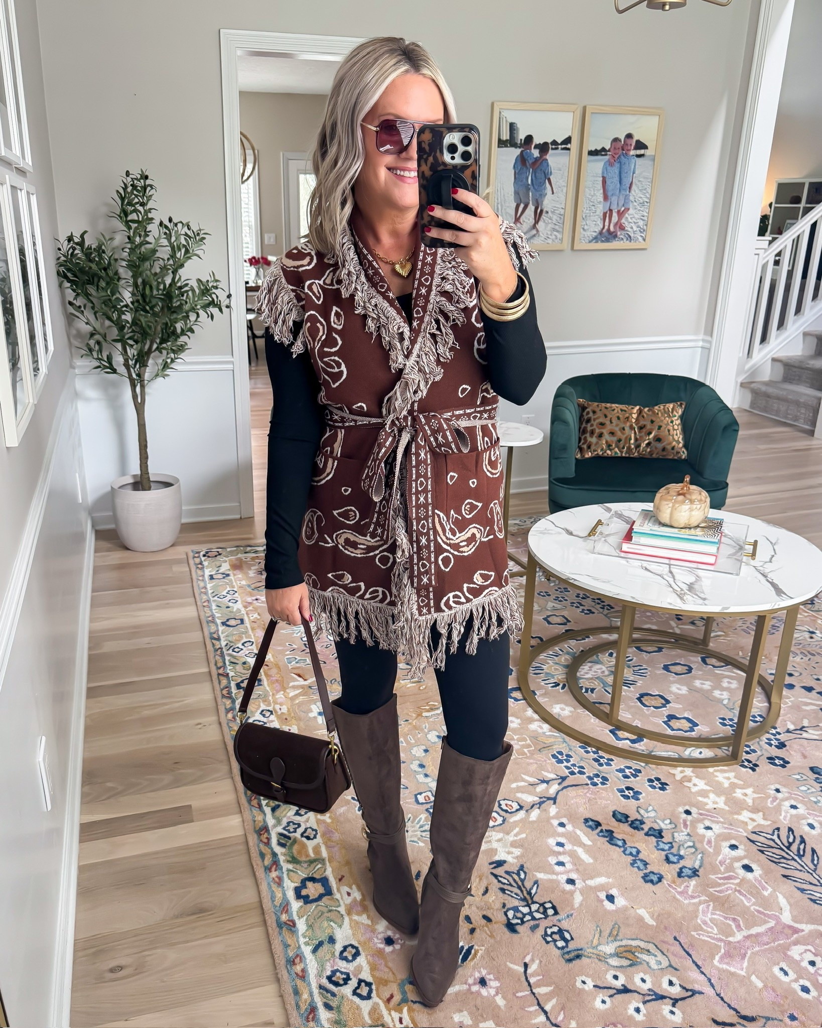 This is such a fun way to layer for fall 🤎 I love the longer belted vest over a fitted black base because it gives the outfit shape without feeling heavy. The fringe and western inspired print add so much texture, and the tall suede boots pull all those rich brown tones together.

western vest, fall layering, belted vest, brown fall outfit, suede boots, leggings outfit, western inspired outfit, fringe vest, casual fall style, fall outfit idea, tall boots, lovelylifestyling

#LTKootd #LTKSeasonal #LTKOver40