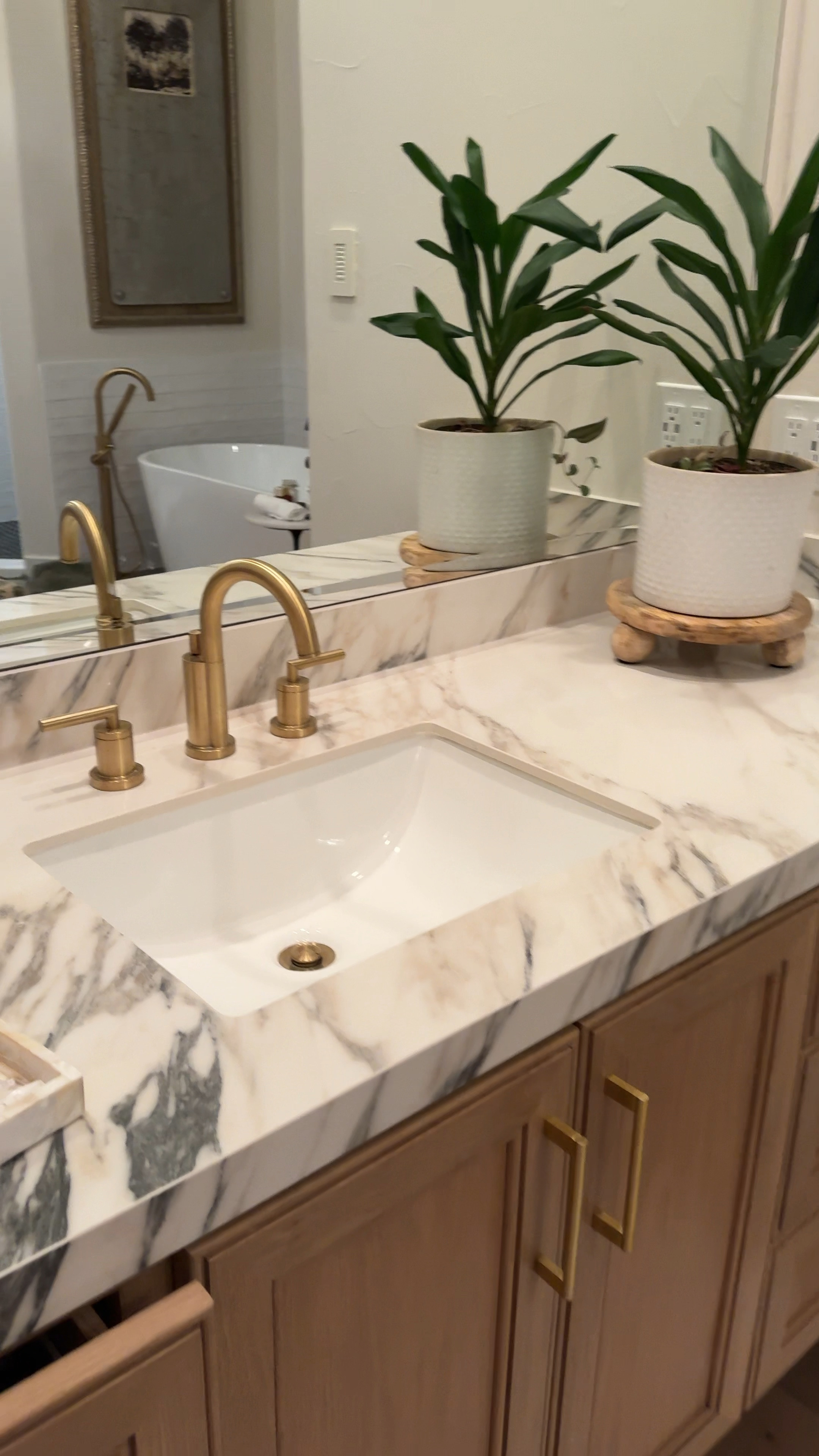 Bathroom sink faucet in brushed brass
White planter and teak wood round planter stand.
White bath rug 
White flower ceramic vase
White marble pedestal table 
Ribbed glass globe bubble chandelier 
Bathroom remodel ~ decor ~ 

#LTKFindsUnder100 #LTKStyleTip #LTKHome
