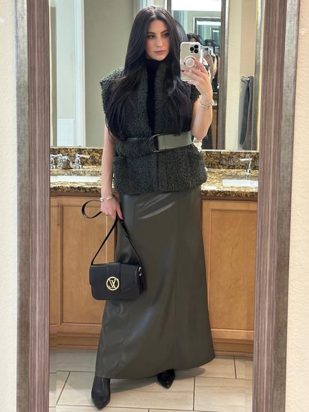 Get dressed with me for dinner & a comedy show.

Marie Oliver's Astrid vest is crafted of sherpa. The North Caro ina-based brand finishes this style with a bold faux leather belt. The vest paired with an alt-leather maxi skirt, black turtleneck, and black booties make for an elevated winter look.

#LTKCyberWeek #LTKHoliday #LTKSeasonal