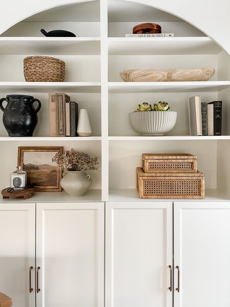 Simple shelf styling pieces: vases, bowls, decorative boxes, books. 

#LTKunder50 #LTKSeasonal #LTKhome