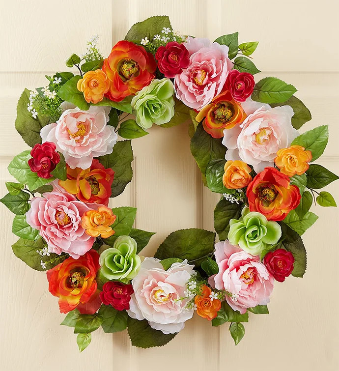 Add some front door flair with our delightful spring wreath. Crafted from authentic faux blooms i... | 1800flowers.com