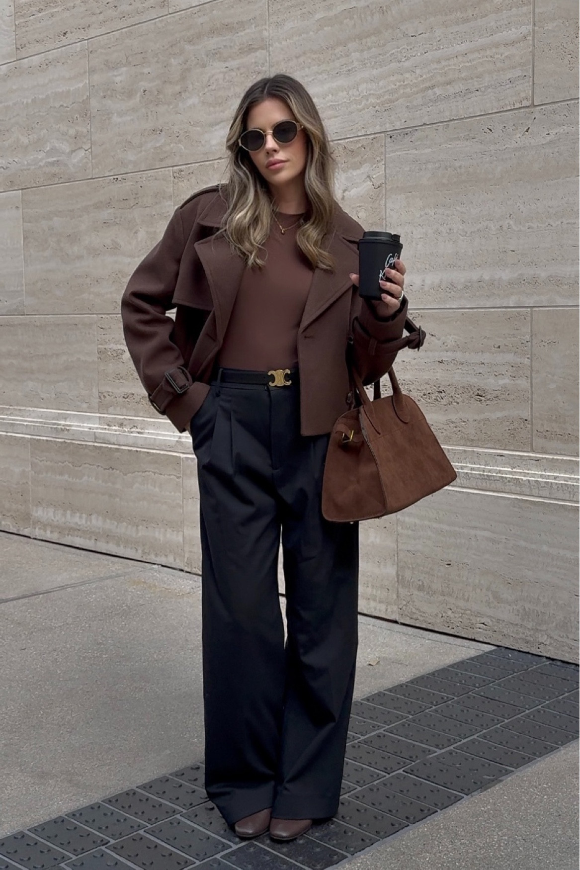 Brown cropped jacket and brown suede bag