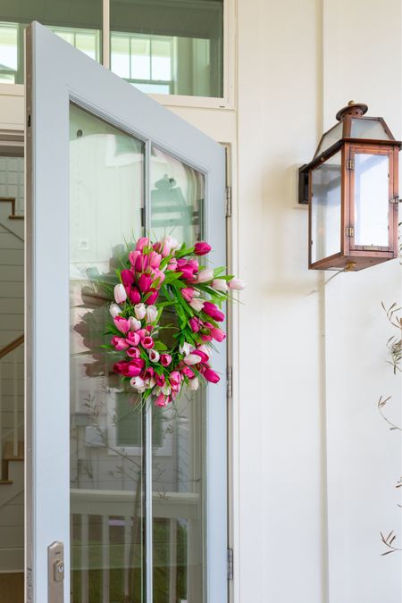 Loving this pink tulip wreath on our front door for spring! It looks so cute paired with our copper gas lanterns, fluted planter and woven door mat.
.
#ltkhome #ltkfindsunder100 #ltkfindsunder50 #ltkstyletip #ltksalealert spring front porch decorating 

#LTKhome #LTKSeasonal #LTKsalealert
