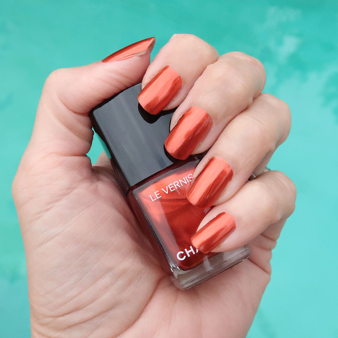 Metallic red-orange nail polish for the holiday season. Bold and festive nail polish color for the 2025 holidays! 

 #LTKHoliday #LTKFindsUnder50 #LTKBeauty