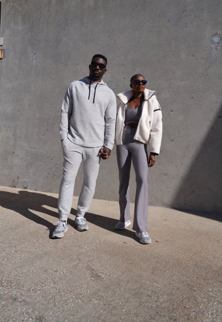 Grey his and hers workout outfits! Grey ruched long sleeve top, grey ruched flare leggings, cream Sherpa full zip jacket with detachable hoodie, grey mens hoodie with pockets, grey sweat pants, grey retro new balance sneakers. 

#LTKfindsunder100 #LTKfamily #LTKfitness
