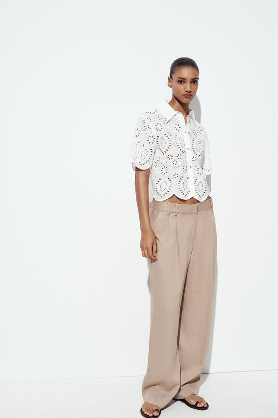 Shirt with a lapel collar and short sleeves. Matching eyelet embroidery detail. Front button clos... | Zara US