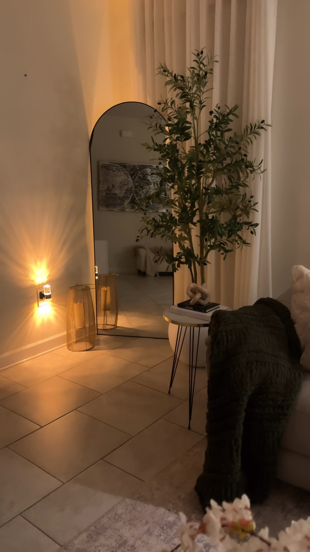 Cozy evening glow ✨ This little corner feels so warm and inviting with soft lighting, an oversized mirror, neutral decor, and an olive tree. Linking all the details to recreate this cozy modern look 🤎🌿

#LTKstorytime #LTKvlog #LTKHome
