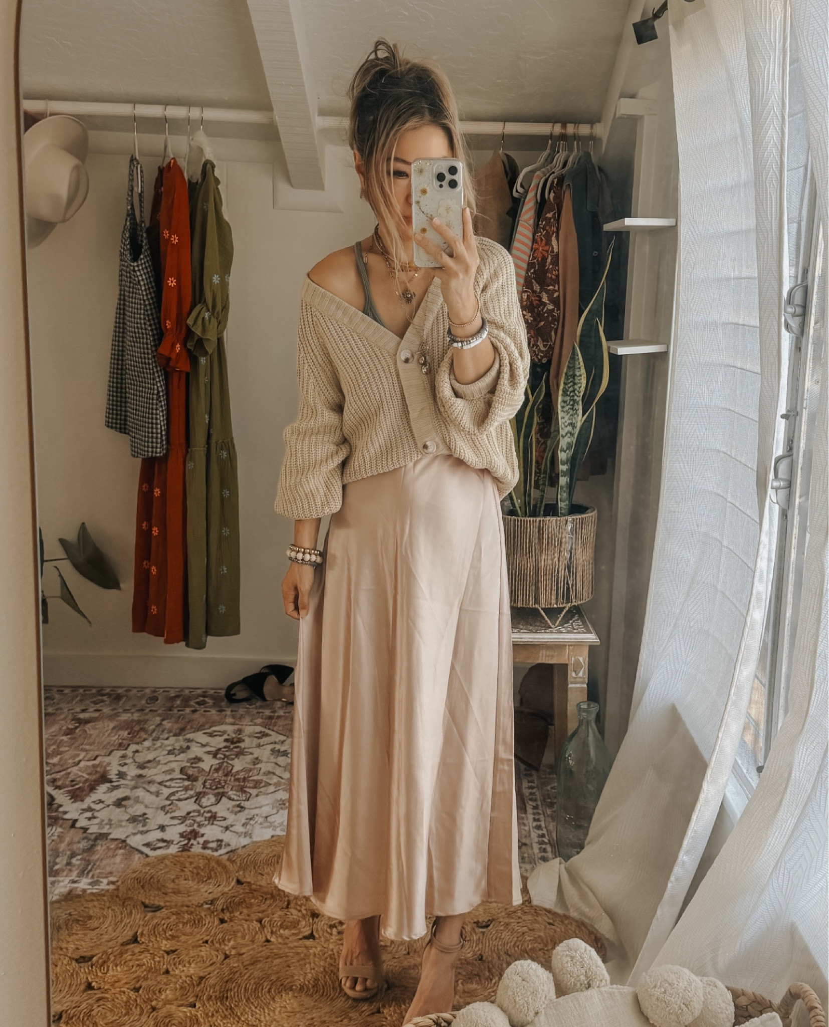 Oversized cropped sweater styled with a satin skirt. I sized up in the cardigan to achieve this slouchy look. 

#LTKstyletip #LTKfindsunder100 #LTKfindsunder50