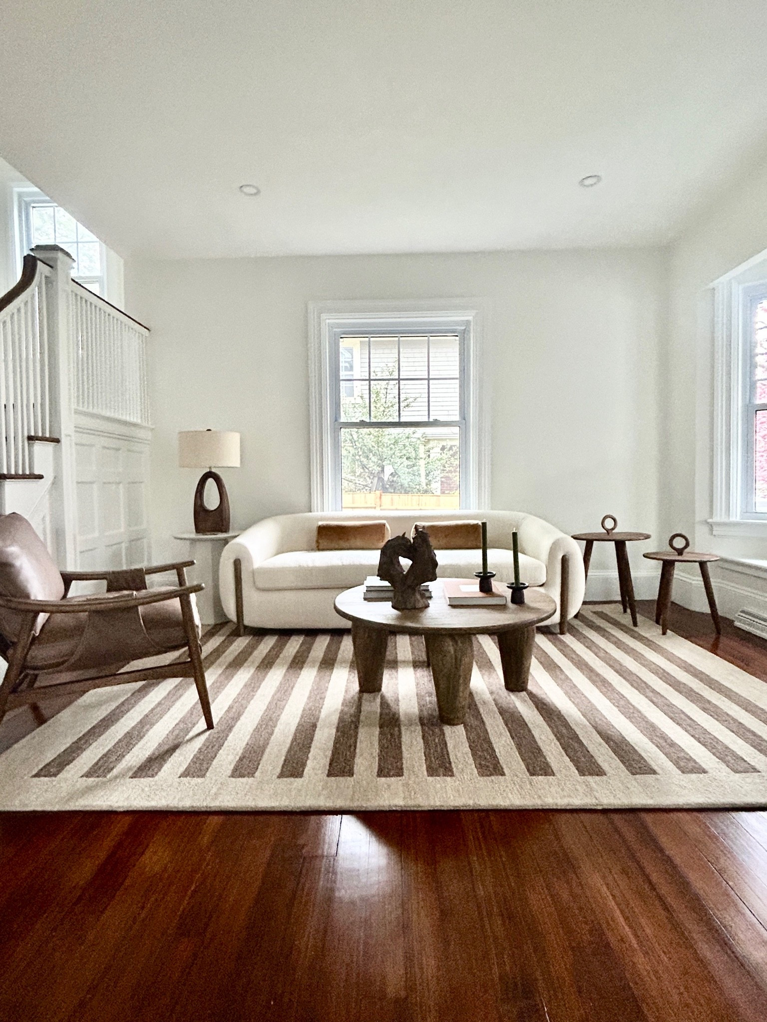 Modern, organic living room.  Striped rug with cream sofa.

#rug #sofa #livingroom