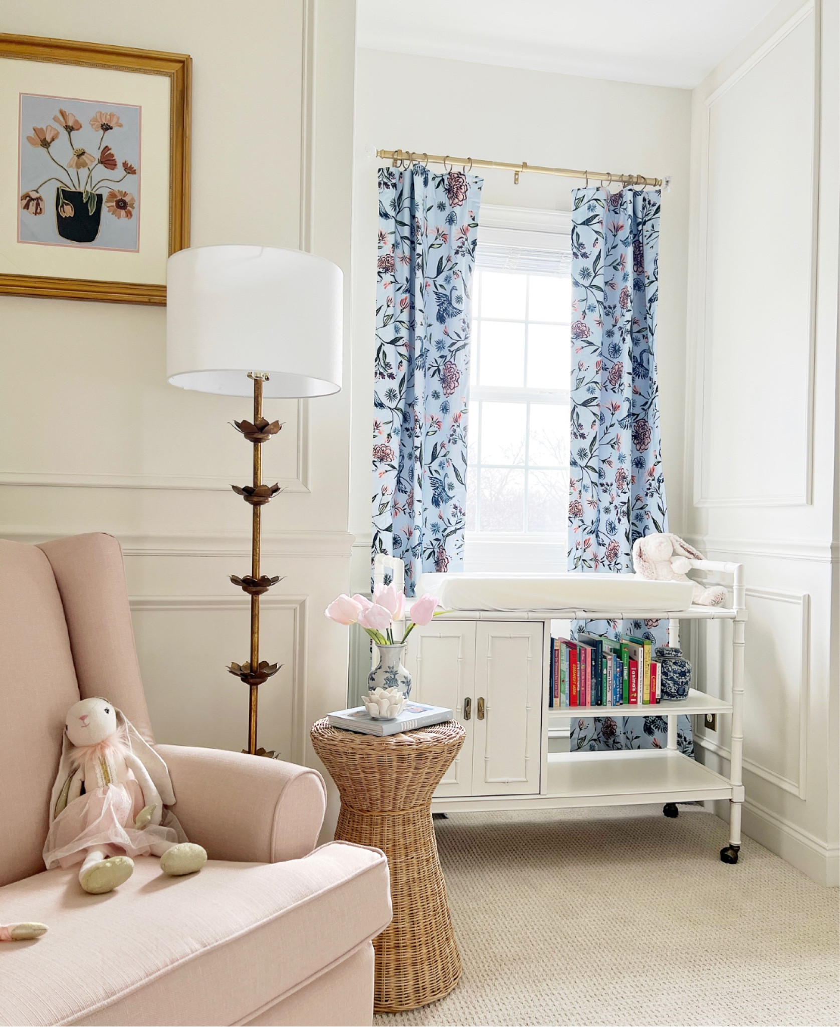 I’m SO excited to reveal our girl’s nursery! This room has been a labor of love to say the least. I’m planning on posting a before and after this week, but wanted to share all the furniture and décor details first. We wanted incorporate patterns and furniture that could grow with our bundle of joy as she gets older. All the furniture (minus the crib) can be used for future kids or in other rooms in our home, which was very important to us. The beautiful vintage bamboo dresser and changing table (a.k.a. a vintage bar cart) came from our friends at @fortheloveof bamboo. I love buying vintage furniture because it benefits our planet and our wallets! My amazing husband crafted and panted the picture frame molding on the walls. It certainly gave the room a traditional and classy feel. I also have to mention her patterned curtains from @pepperhome! We loved combining blue and pink throughout her space and these curtains gave us the courage to do so! I’m linking all other furniture and some décor below and in my bio! Let me know what you think! 
.
.
.
Dresser: @fortheloveof bamboo
Changing table (barcart): @fortheloveof bamboo
Glider: @birchlane
Wicker side table: @serena&lily (similar/cheaper option linked in bio)
Crib: @wayfair 
Pink Chinoiserie Lamps: @overstock 
Gold floral floor lamp: @overstock 
Curtains: @pepperhome 
Fiddle tree: @amazon
Art: Etsy (shop name-AlexMooreGibsonArt)

#babygirlnursery #nursery #babygirl #baby #babydecor #traditionalnursery 
#grandmillennial
 #grandmillennialdecor #charlotteblogger #charlotte #coastalgrandmother #coastalstyle #style  #fashion#amazonfashion #asos #etsy #overstock #vintage #wayfair #babyglider #crib #pepperhome

#LTKstyletip #LTKhome #LTKbaby