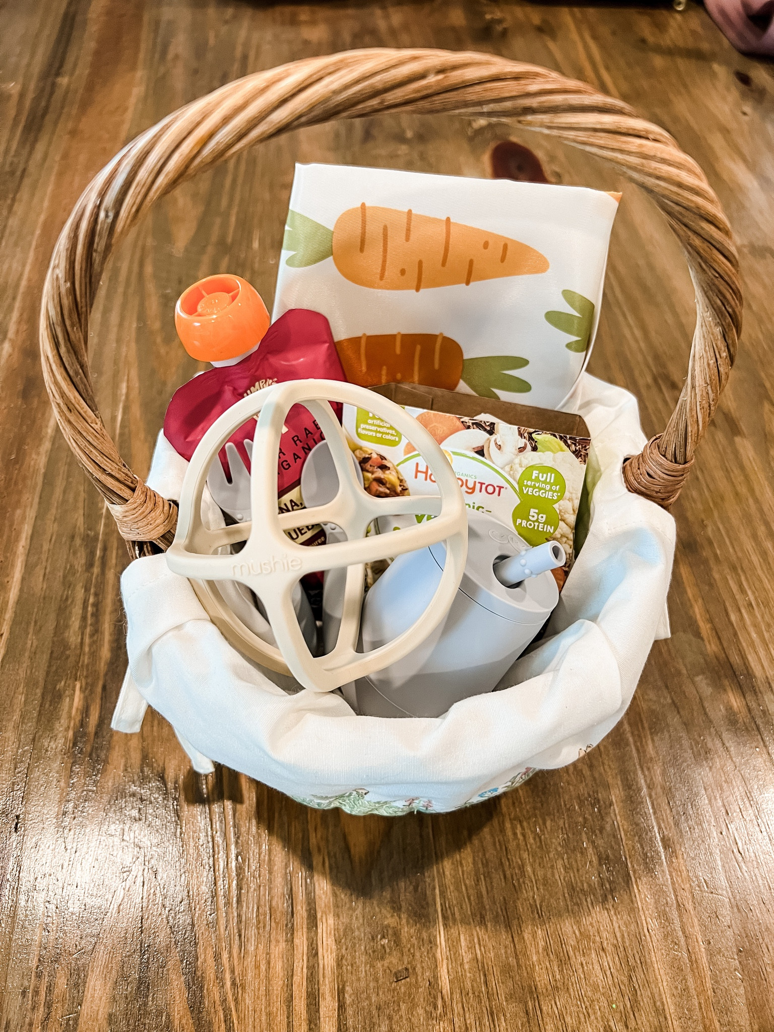 Already working on easter baskets! These are all baby items I found at Target and Amazon for our little one who is starting solids and getting his first teeth! This basket is the small size from pottery barn and has the Peter Rabbit insert.

pottery barn easter basket | peter rabbit easter basket liner | wipeable bib with sleeves | organic pouch | organic rice with veggies | ezpz fork and spoon | ezpz straw cup | mushie teether ball

#LTKbaby #LTKSeasonal #LTKfamily
