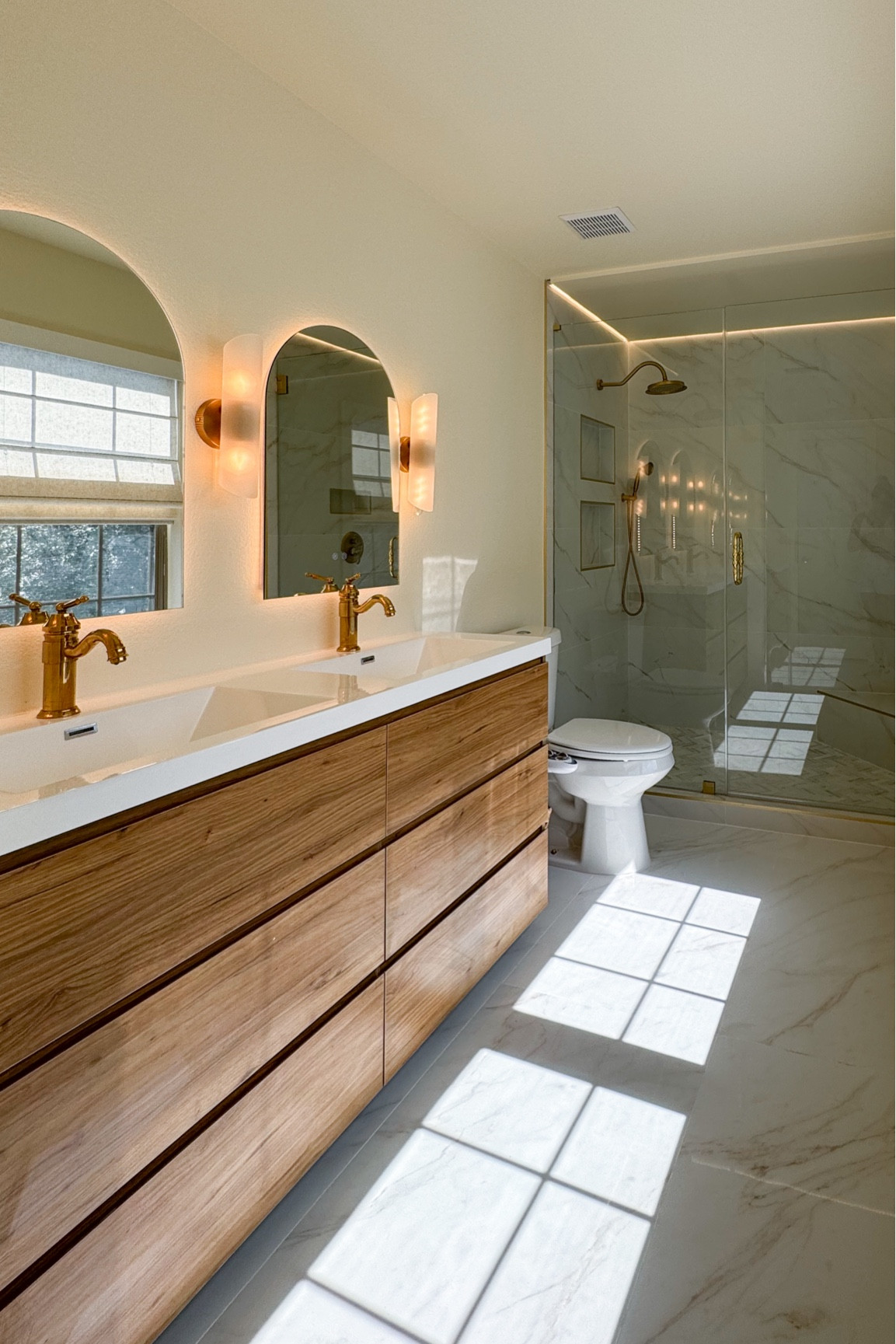 Still not over this primary bathroom transformation🤩😍 the vanity that y’all helped pick out awhile ago is from @wayfair and is SO perfect for the space to really bring out the warm tones of the tile. Wayfair is having their Black Friday in July right now, up to 80% off & free shipping — it’s the perfect time to refresh your space or get those investment pieces for your renovations! I’ll link my sales picks on my LTK 🙌✨#ad #wayfairpartner #wayfair#LTKSummerSales 

#LTKHome #LTKSeasonal