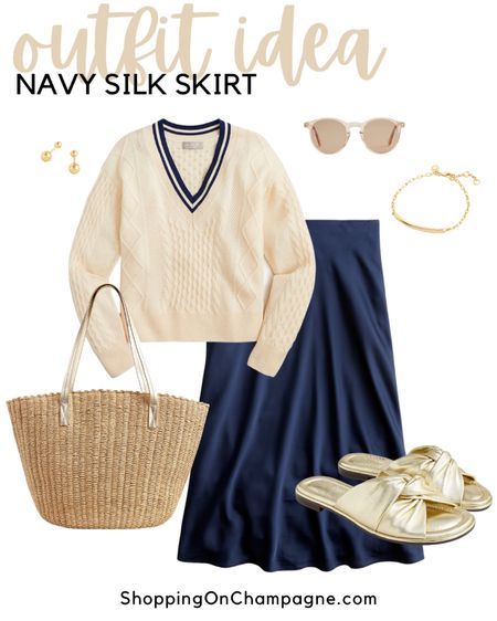 Spring Outfit! Modern twist on a classic outfit! This a-line navy silky midi skirt pairs perfectly with a v-neck cabled cream cashmere sweater with navy accents. Add gold slides, a gold handled basket bag, earrings, I.D. Bracelet, and sunglasses.✨Great for work or casual wear!✨


#LTKstyletip #LTKworkwear #LTKSeasonal
