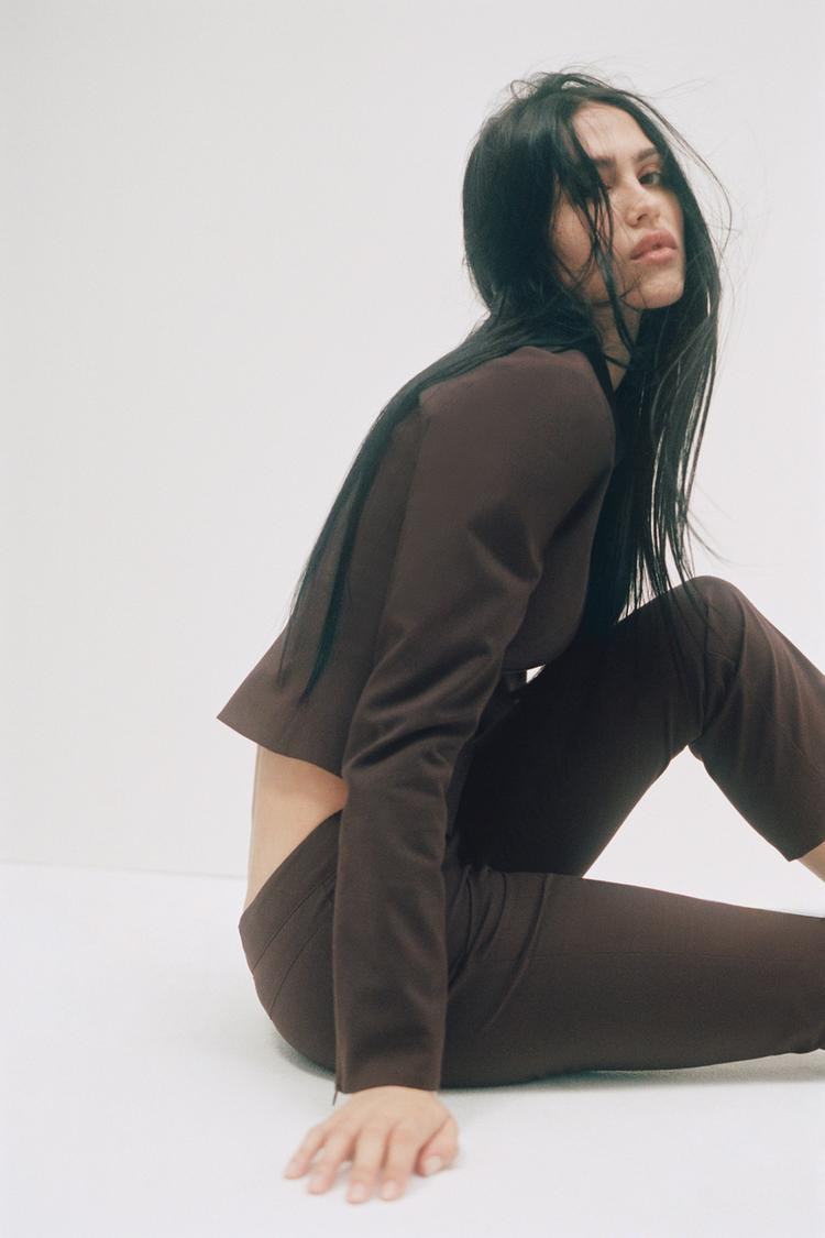 Fitted jacket with lapel collar and long sleeves with a concealed zipper. Features marked seams. ... | Zara US