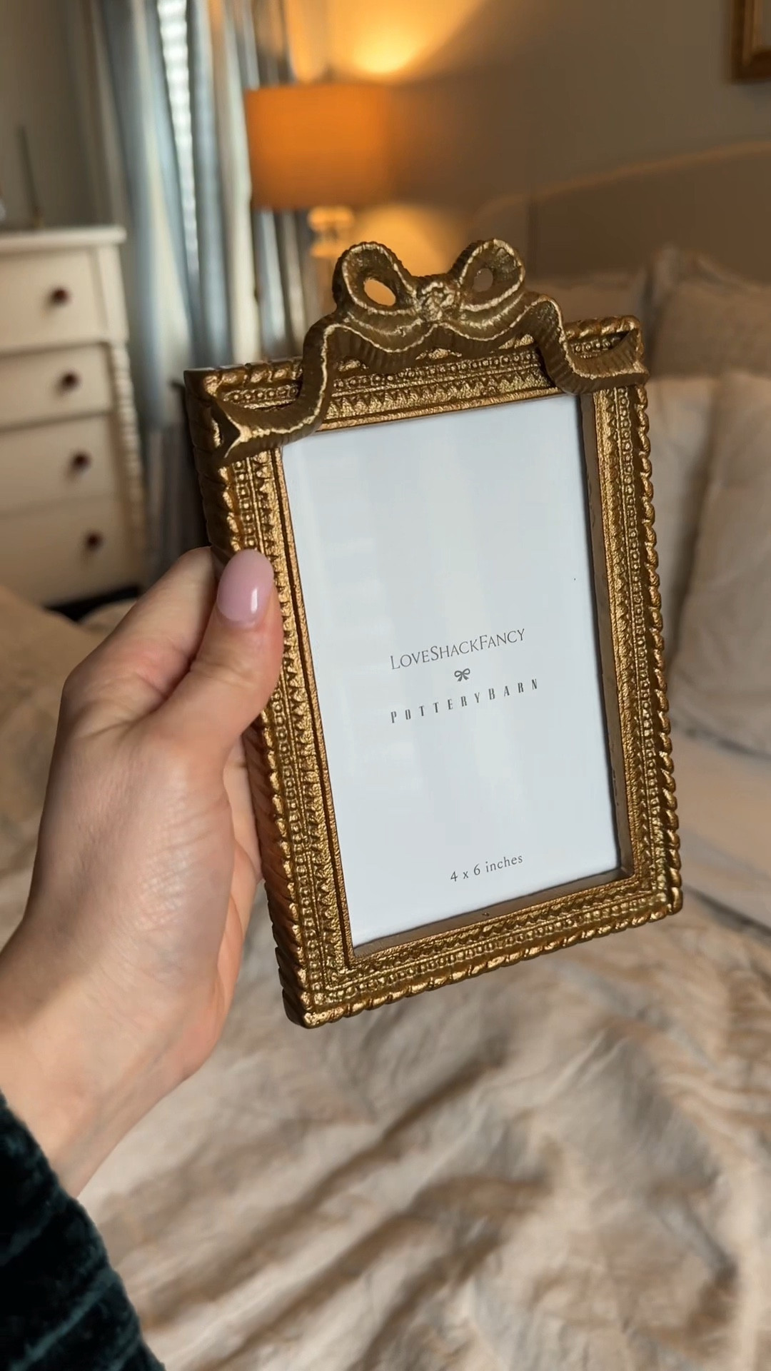 The prettiest little frame I’ve added to my nightstand 🎀

This LoveShackFancy x Pottery Barn frame is everything — the bow detail, the gold finish, the romantic feel… it instantly makes any space look more elevated and expensive

I love that it feels vintage-inspired but still fresh and girly 🤍 perfect for bedside tables, shelves, or styling a dresser 

#LTKSeasonal #LTKHome