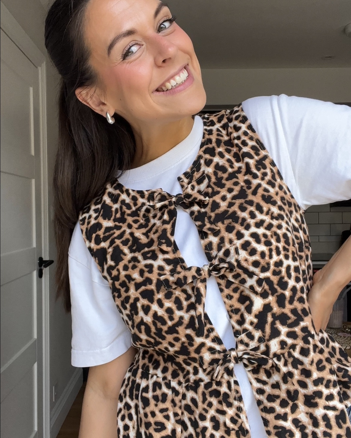 a leo moment🐆✨

leopard print bow tie vest, white boxy tshirt, blue denim long skirt, sambas, office outfit

#LTKsummer #LTKworkwear #LTKspring