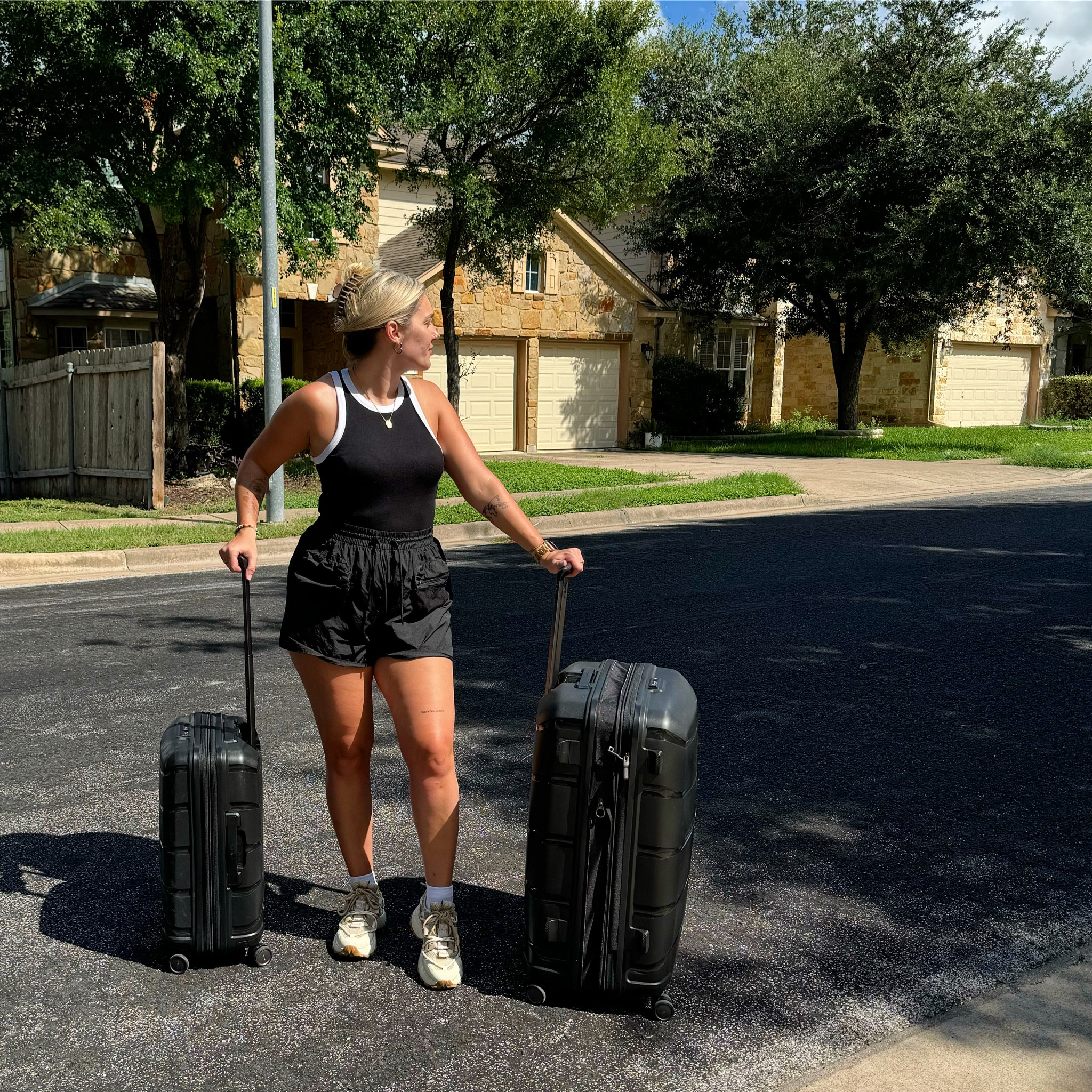 Airport fit check ✈️ monochrome lightweight stretchy vest and airy baggy move shorts with drawstring and pockets teamed with chunky trainers and chunkier black luggage.

#LTKsummer #LTKtravel