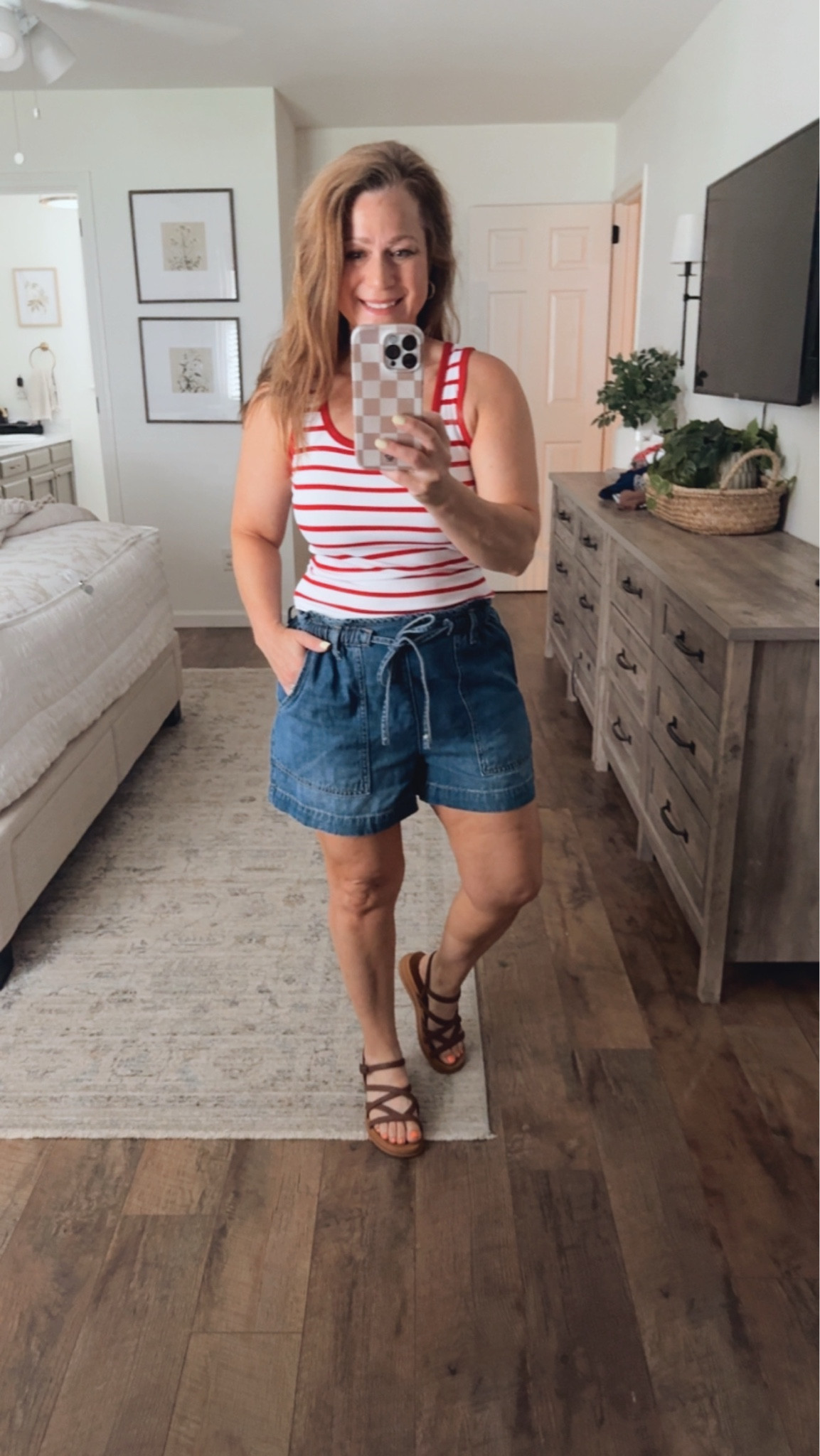Summer outfit idea 
Perfect for the 4th of July and all summer 
Denim shorts 
Red white stripe tank 
Sandals 

I am in a small in top and Shorts, sandals TTS

#LTKPetite #LTKootd #LTKMidsize