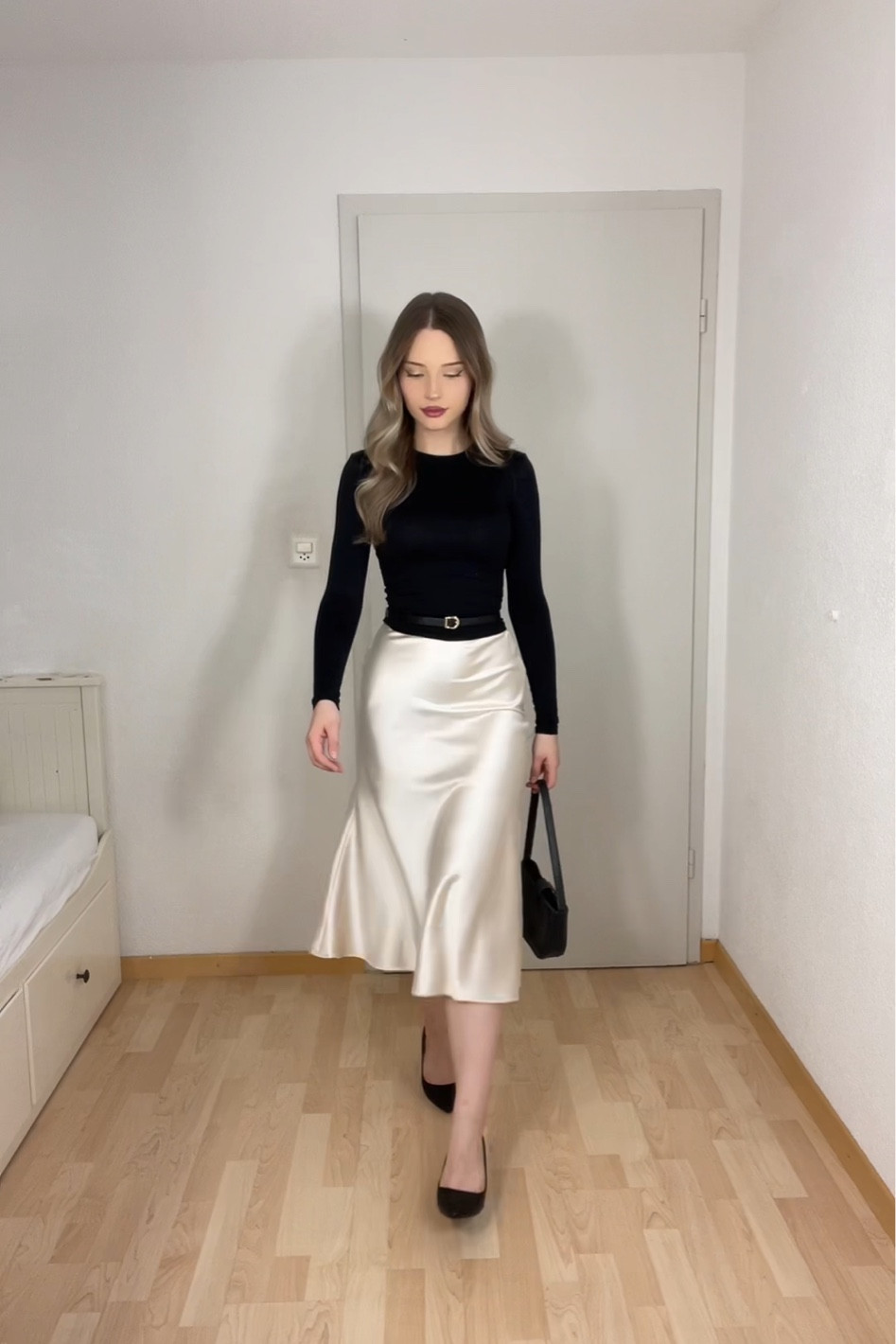 Classic elegance for any occasion! This sleek black long-sleeve top pairs perfectly with a champagne satin midi skirt, cinched at the waist with a slim belt for definition. Finished with black pumps and a minimalist handbag, this outfit is timeless and polished – perfect for dinners, events, or an evening out.

#TimelessStyle #ElegantOutfit #ChicAndClassic #SatinSkirt #MonochromeLook #PolishedStyle #MinimalistFashion #EffortlessElegance #EveningOutfit #ClassyVibes #WardrobeEssentials #LTKstyle #LTKchic #OutfitInspiration