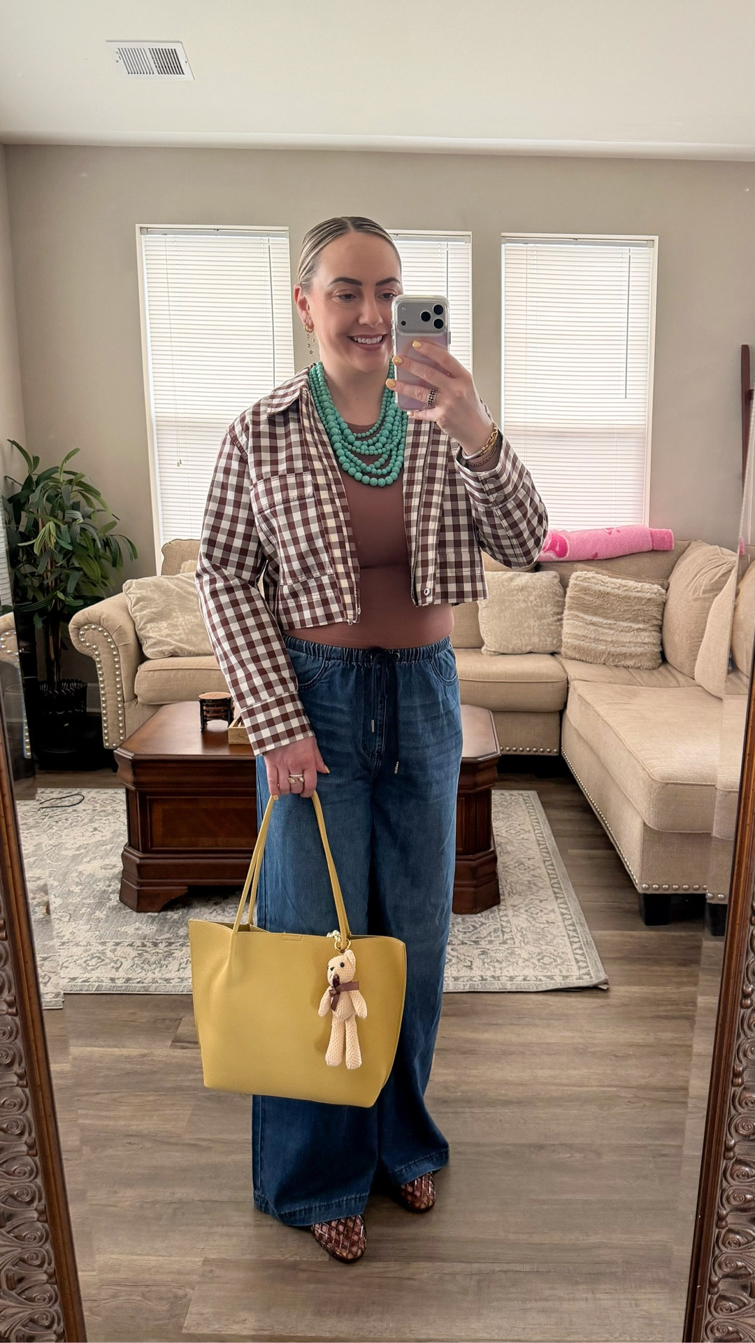 Tall girl friendly wide leg jeans outfit + jelly flats 🤎

Such a fun tall girl friendly spring outfit with wide leg denim, a cropped gingham jacket, neutral tee shirt, and statement turquoise necklace. The yellow tote adds the perfect pop of color, and the woven jelly flats are a major trend this season.

Perfect for brunch, casual work days, weekend errands, or a coffee date.

Fit details: wearing size L in the jacket
Jeans size 7 super stretchy 

#LTKootd #LTKTall