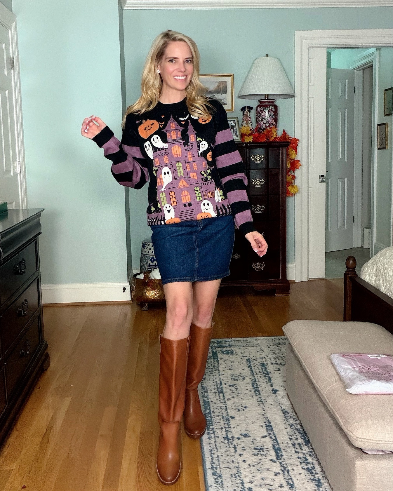 Spooky Cute Halloween Sweater Outfit 🎃👻
Are we doing cute and cozy or spooky and stylish this Halloween?! 🖤💜 This oversized Halloween sweater is giving all the fun fall vibes with its colorful haunted house, smiling ghosts, pumpkins, and striped sleeves!
I paired it with a classic denim mini skirt and cognac knee-high boots for an easy Halloween outfit that feels playful but still chic. Perfect for pumpkin patch outings, Halloween festivities, fall festivals, or a casual October day! 🍂
The sweater is such a fun statement piece, and the boots make it easy to transition this look into cooler weather.
Shop this Amazon Halloween sweater, denim mini skirt, cognac knee-high boots, and more festive fall outfit finds!
Halloween sweater for women, spooky season outfits, cute Halloween fashion, ghost sweater, haunted house sweater, pumpkin sweater, purple and black Halloween outfit, denim mini skirt, cognac knee-high boots, brown leather riding boots, Amazon Halloween finds, affordable Halloween outfits, preppy Halloween style, fall transition outfits, casual fall fashion, festive fall outfit inspiration.

#LTKOver40 #LTKSeasonal #LTKootd