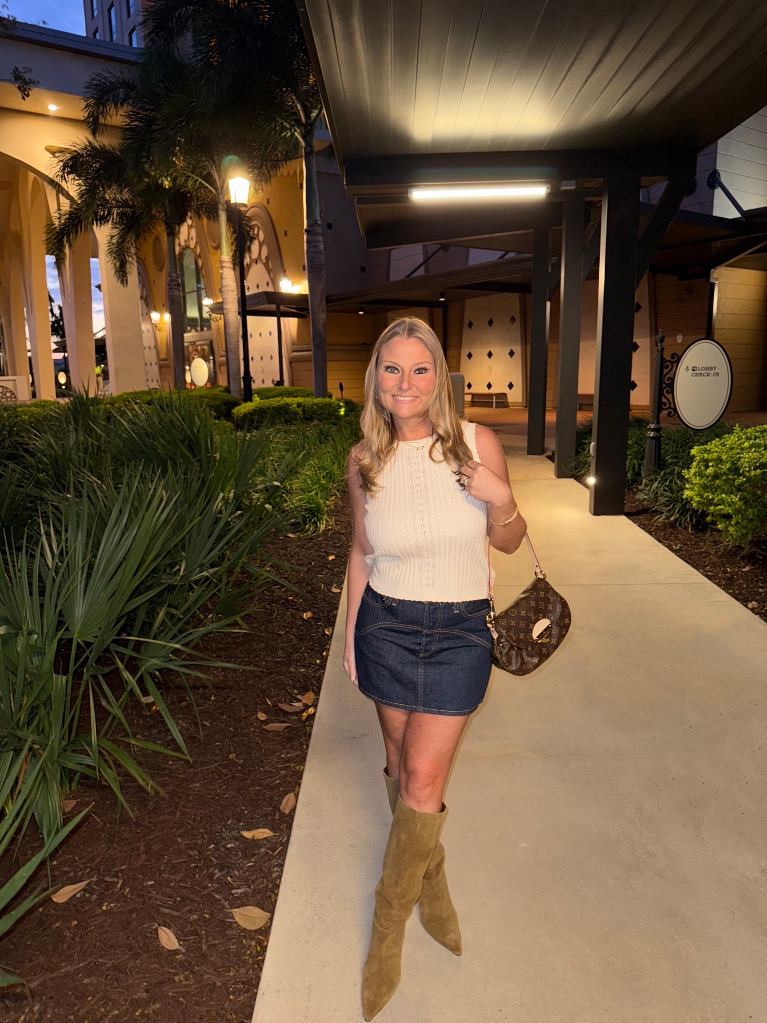 This dark denim skirt by Levi’s is perfect for fall. It runs small and short. I would recommend sizing up by one size. I paired with a Target sweater tank and Zara boots for a fun night out while in Orlando.

#LTKTravel #LTKGiftGuide #LTKStyleTip