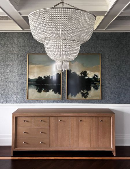 Moody, dramatic dining room. Statement lighting, an amazing art pairing and this gorgeous chandelier make the room pop! 

#LTKhome #LTKstyletip #LTKsalealert