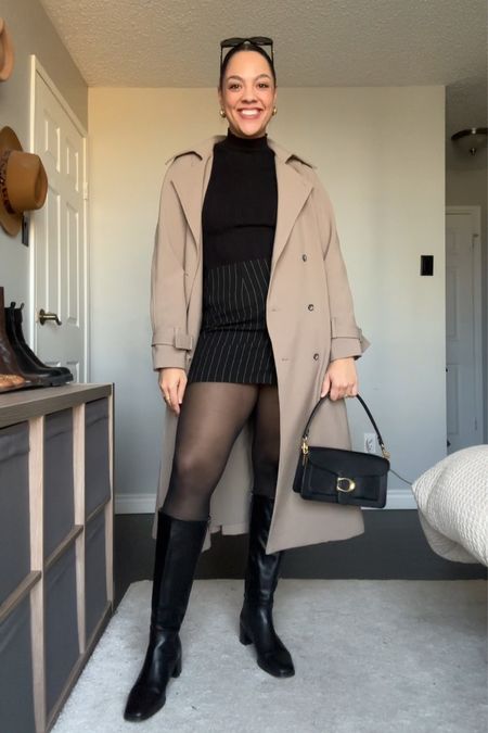 Winter outfit inspiration! Details below:
-Black pinstripe mini skirt from Madewell, fits a bit big, I sized down to a 6. 
-Black long sleeved ribbed mock neck top from Abercrombie, I have a medium. 
-Oversized trench coat from Oak + Fort, I have the colour brindle and size medium. 
-Coach tabby shoulder bag. 
-Knee high black leather boots. 
-Celine Triomphe sunglasses. 


#LTKSeasonal #LTKfindsunder100 #LTKstyletip