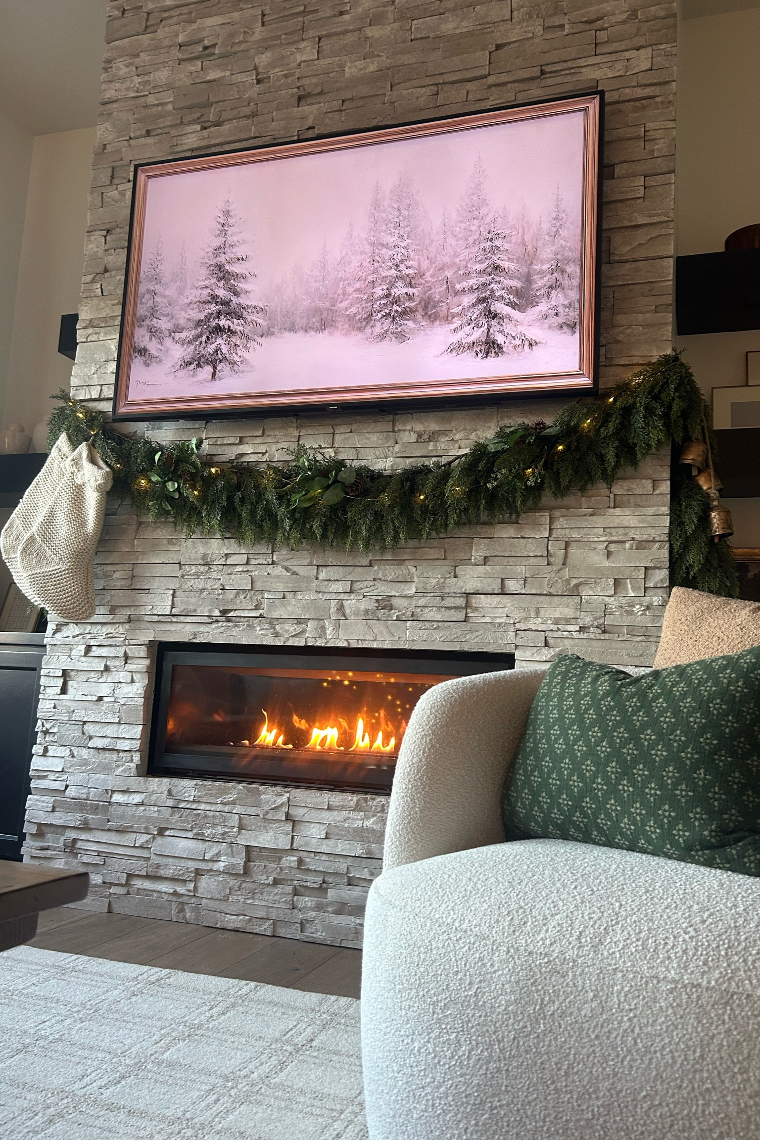 Holiday Fireplace decor | Christmas decorations | Cedar garland | cozy white stockings 

#LTKSeasonal #LTKHoliday #LTKHome