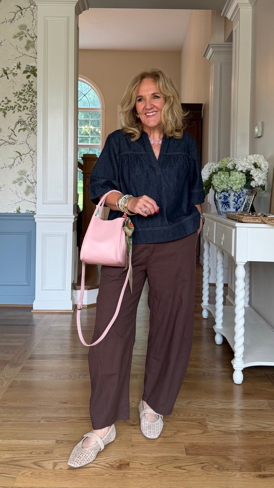 I’m really liking these deeper colors together, and that little pink bag is such a fun surprise. I’m wearing a medium in both the denim top and the pants.

#LTKootd #LTKOver40 #LTKPetite