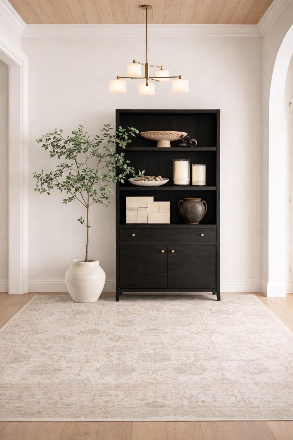 Adding a tall cabinet like this one to a hallway is a beautiful way to create height, or accentuate a ceiling detail. I love how although this piece is black, it still feels light and timeless in this space. 

#LTKHome