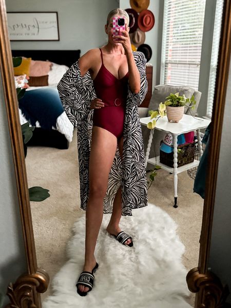 Belted one piece swimsuit with adjustable straps
Runs small + size up one size 
great booty coverage 8/10
__________
Animal printed duster cover up
size doesn’t matter, I’m wearing a L/XL
also has matching swimsuit and I linked it 

#LTKswim #LTKstyletip #LTKfindsunder50