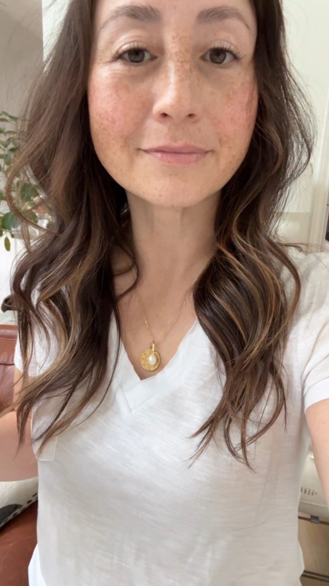 Favorite new white T-shirt I have four. Wearing size small  very flattering fit. Perfect not too baggy not too tight. Cay necklace with pearl charm for magical vibes