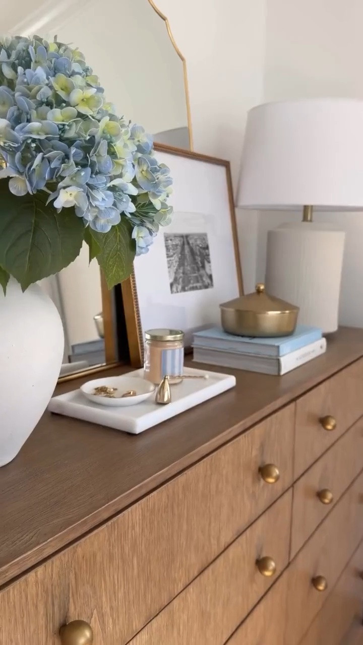 There’s something about a beautiful dresser that instantly makes a bedroom feel more finished. 🤎✨

I love how this piece brings in the perfect mix of timeless charm and coastal-inspired style. The soft details, warm wood tones, and classic silhouette make the space feel light, cozy, and effortlessly elevated.

A few thoughtfully chosen accents were all it took to create a room that feels calm, inviting, and full of personality. It’s amazing how one furniture piece can completely transform the look and feel of a space. 🌿

#LTKHome #LTKvlog #LTKmomlife