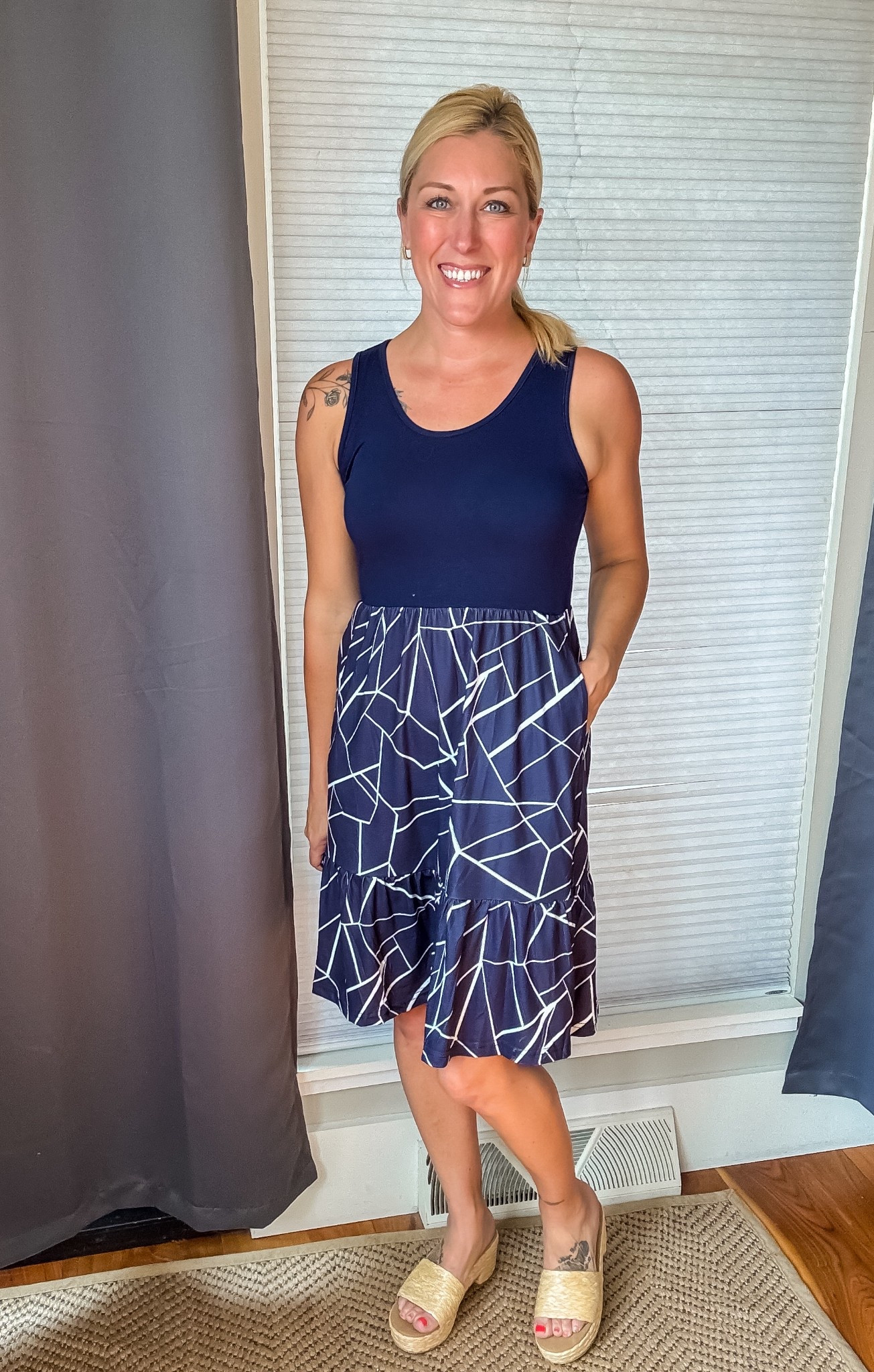 This sleeveless dress is the perfect combo of comfy and cute—The high waist, flowy tiered skirt, and fun geometric pattern give it a stylish edge, and yes… it has pockets! 🙌