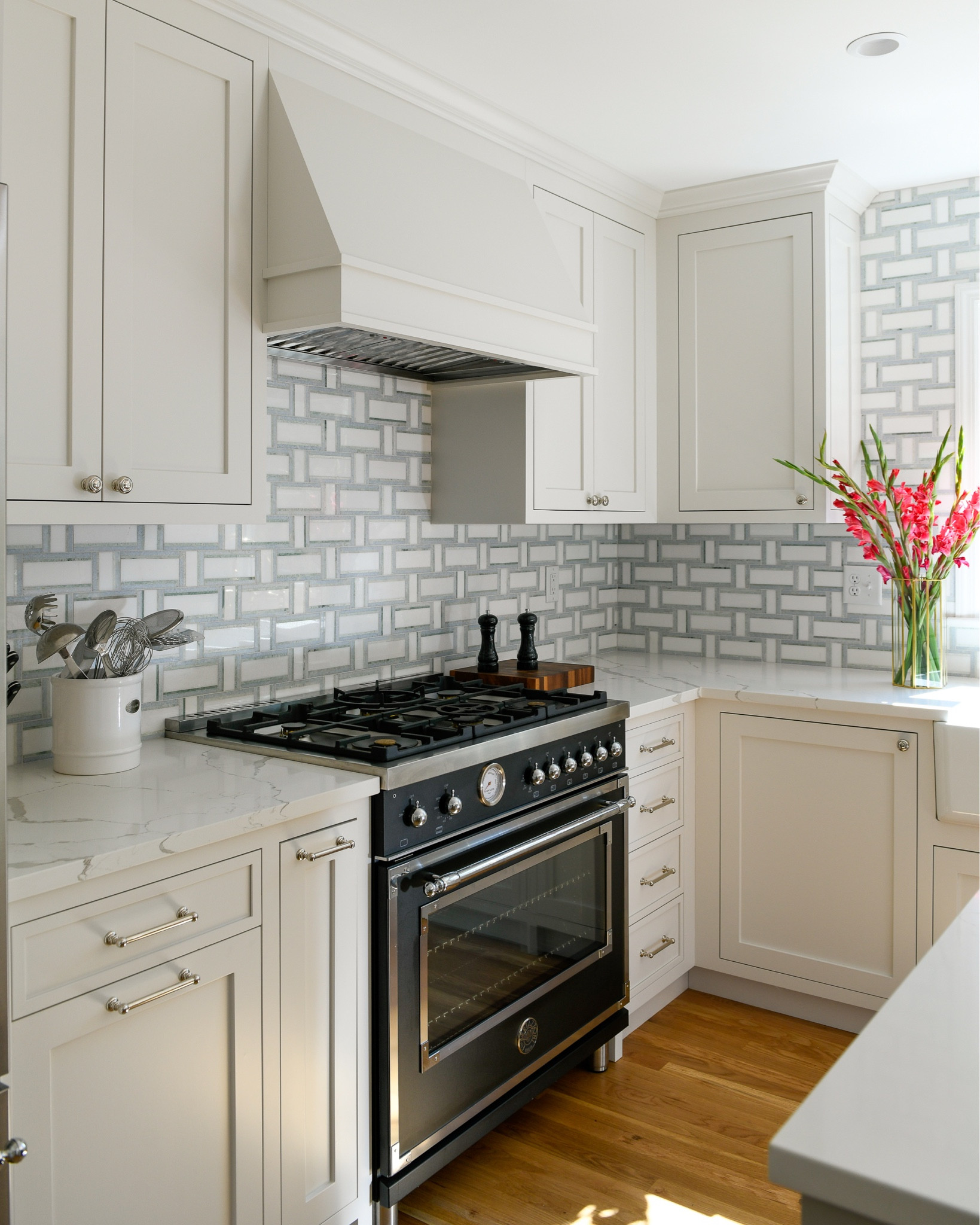 A fresh traditional classic kitchen with marble basketweave tile backsplash, vintage range, polished nickel hardware

#LTKhome #LTKFind