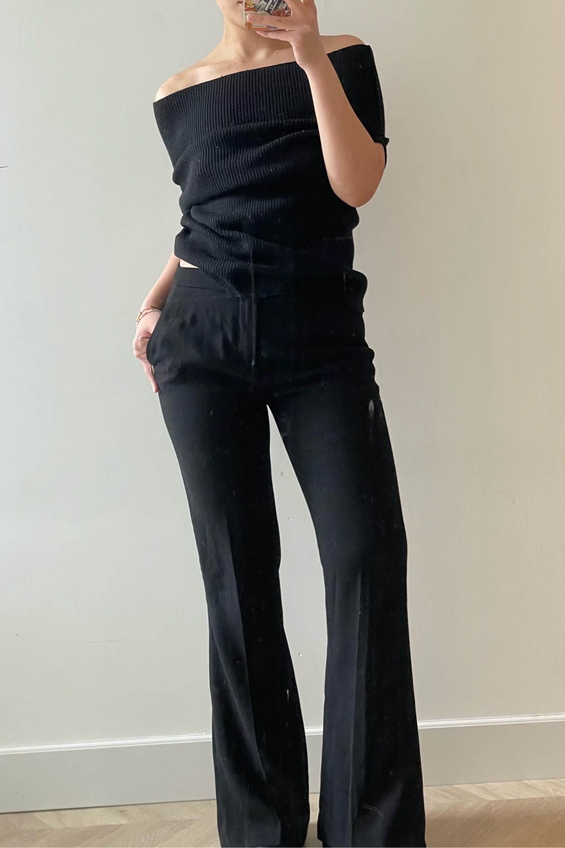 Toteme (Totême) black off shoulder knit top (alpaca wool mix) with flared tailored pants (mine is an old Zara one but a really good alternative is the Theory Dimitria one - which is on sale at Zalando right now!)

All black outfit 🖤 

#LTKstyletip #LTKeurope #LTKworkwear