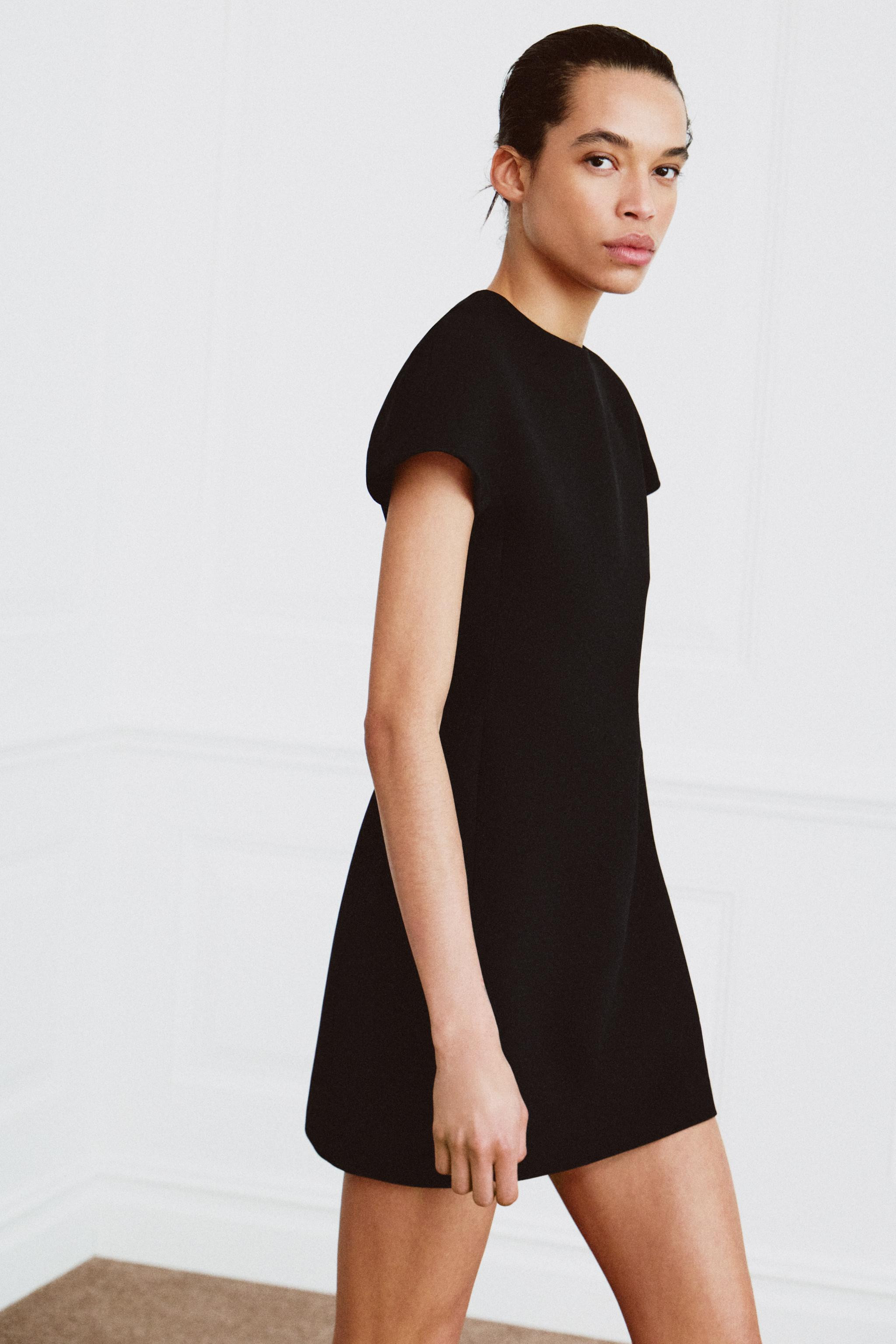 ZARA WOMAN COLLECTIONShort dress with a round neck and short sleeves. Tonal inner lining. Straigh... | Zara US