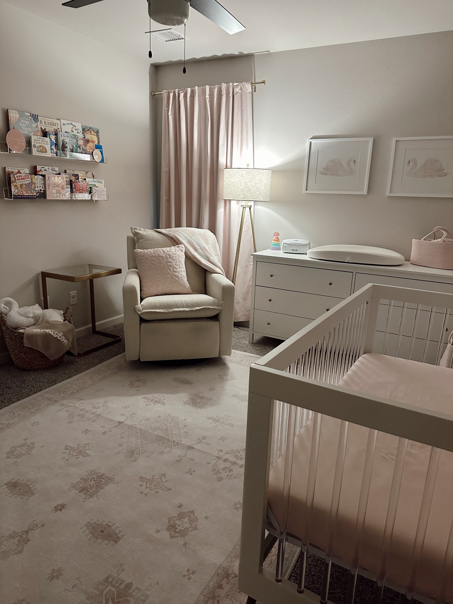 Baby girl nursery #AcrylicCrib #FloatingBookshelf #BabyBlanket #NurseryRug #NurseryLamp #NurseryWallDecor #NurseryCurtains #LightPinkNursery #SwanNurseryDecor