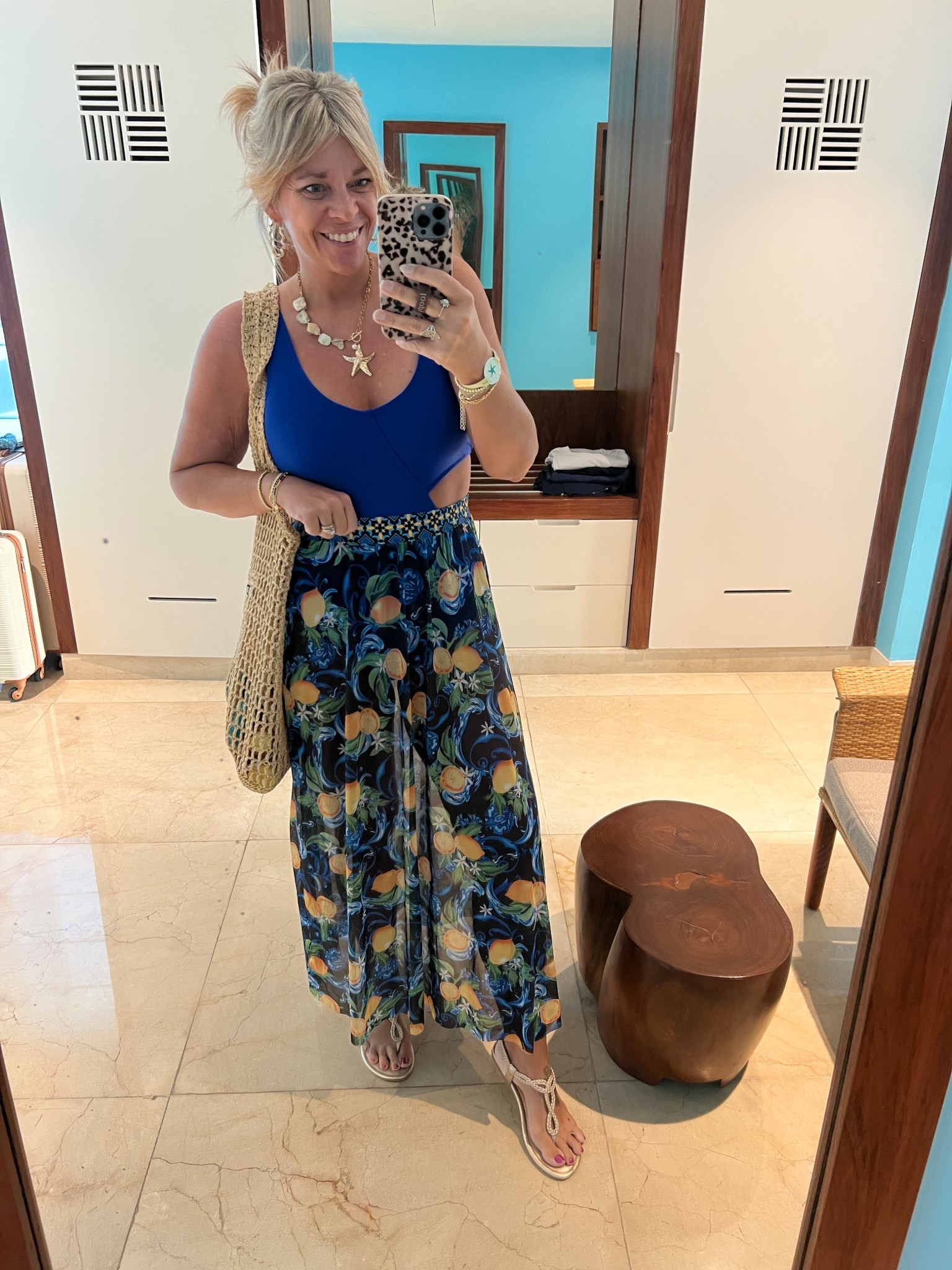 Cutout swimsuit size large and coordinating swim skirt coverup size 12. Linked up my accessories too! 

#LTKOver40 #LTKMidsize #LTKSeasonal